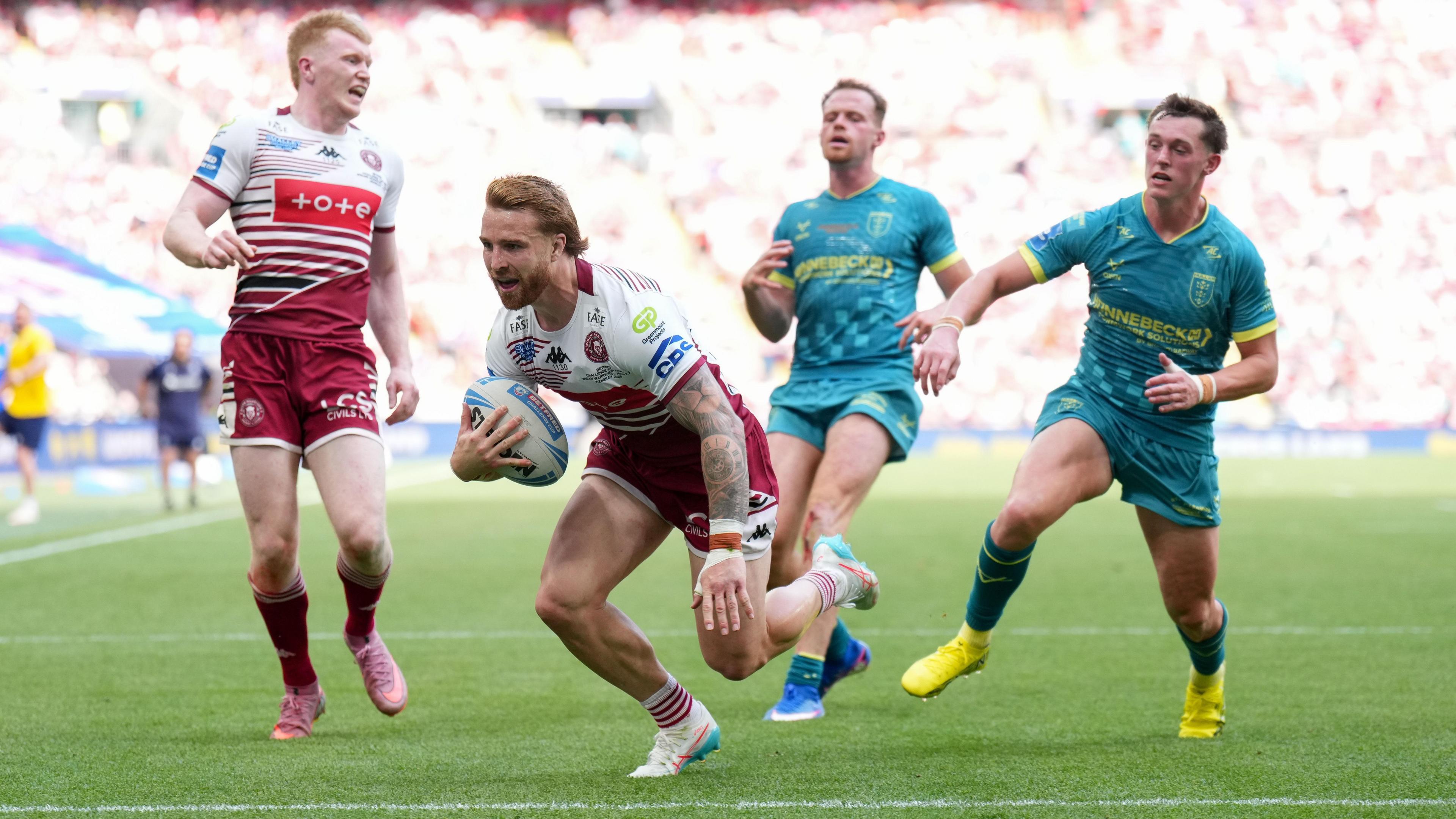 Adam Keighran dives over the try-line