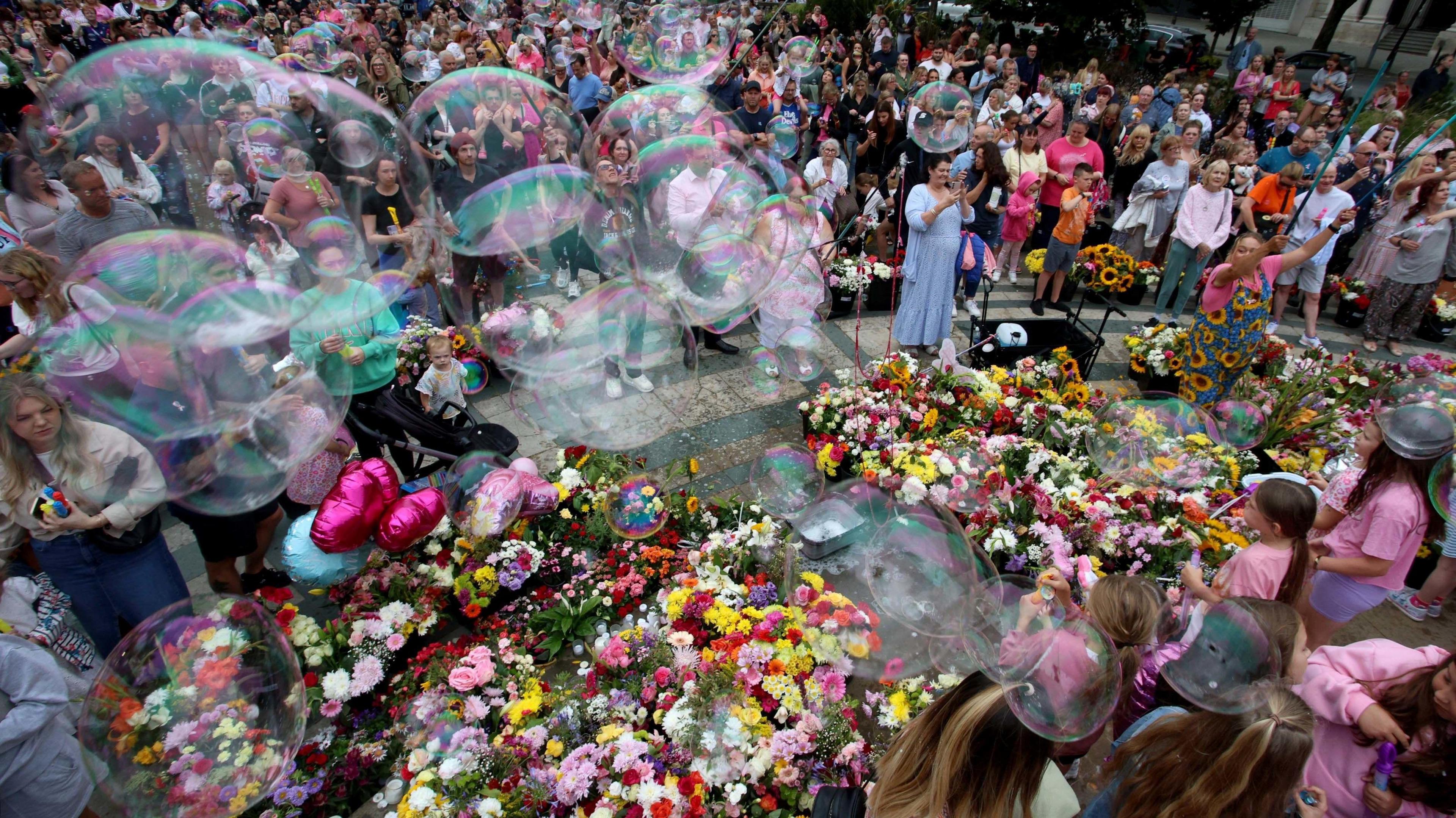 Hundreds attended a vigil for the victims of the Southport attack. There was hundreds of flowers, balloons and tributes left with huge bubbles blown at the event in the Town Hall Gardens outside The Atkinson in Southport.