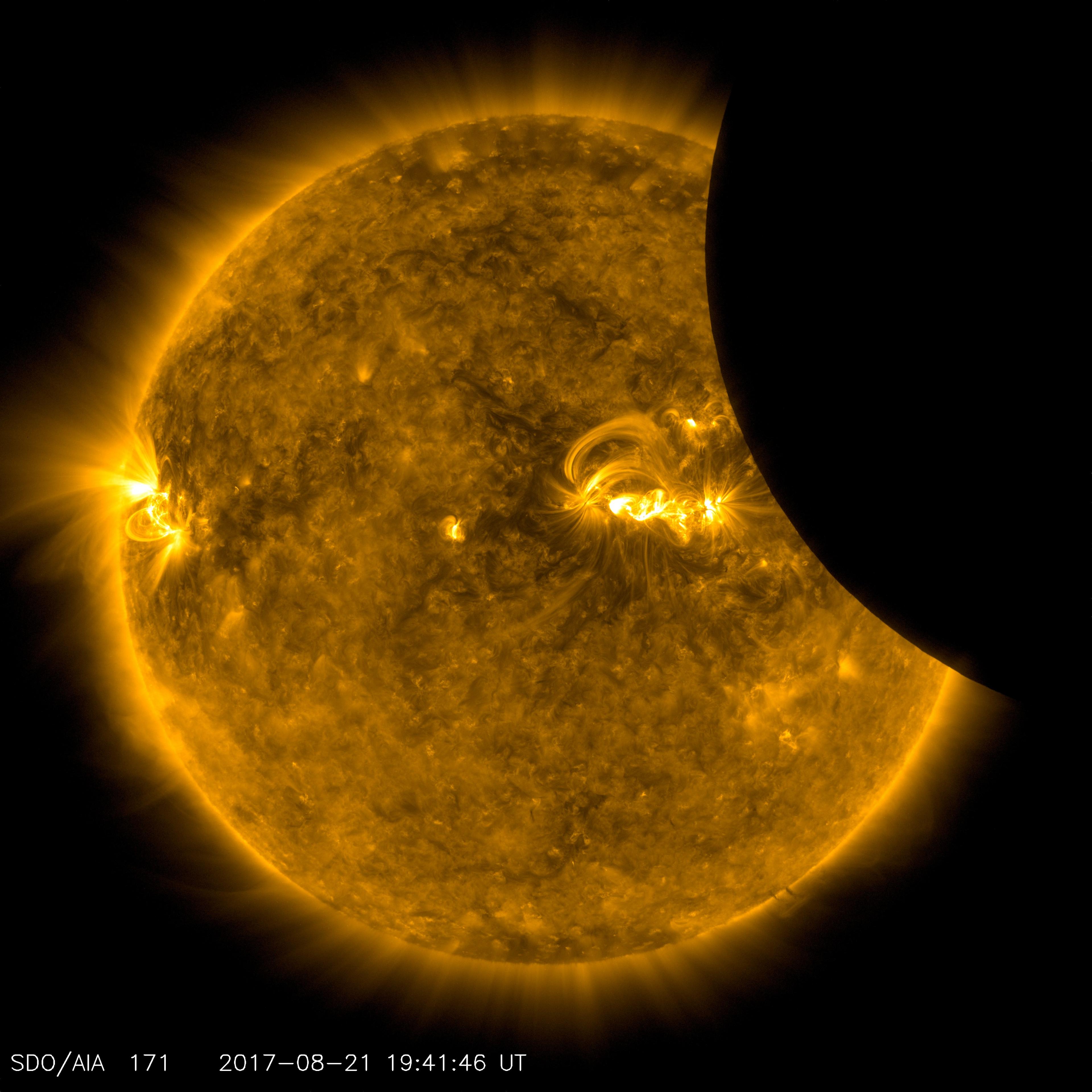 Image of the Moon transiting across the Sun, taken by SDO in 171 angstrom extreme ultraviolet light on Aug. 21, 2017.