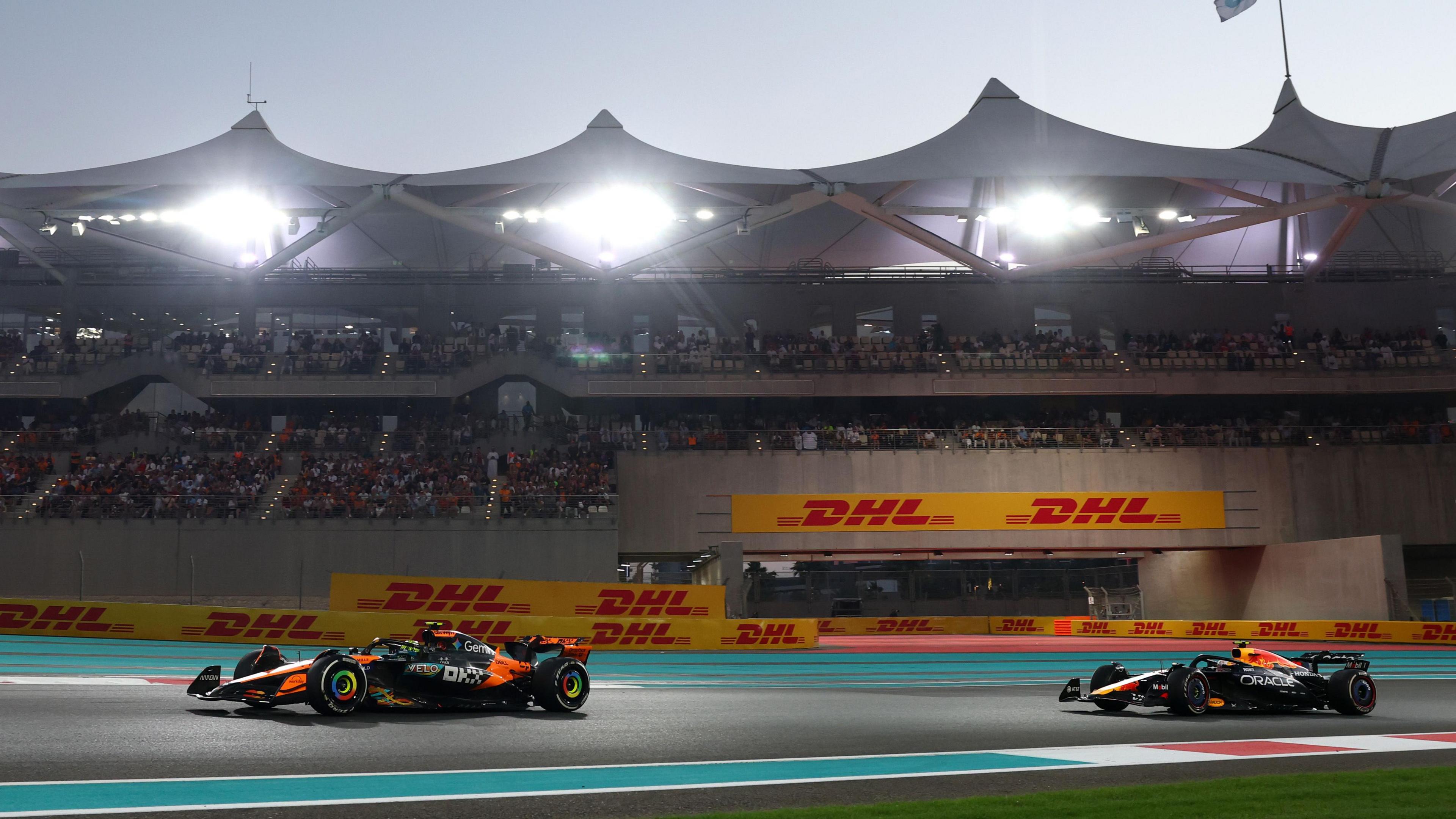 Two cars driving down the track during the F1 grand prix