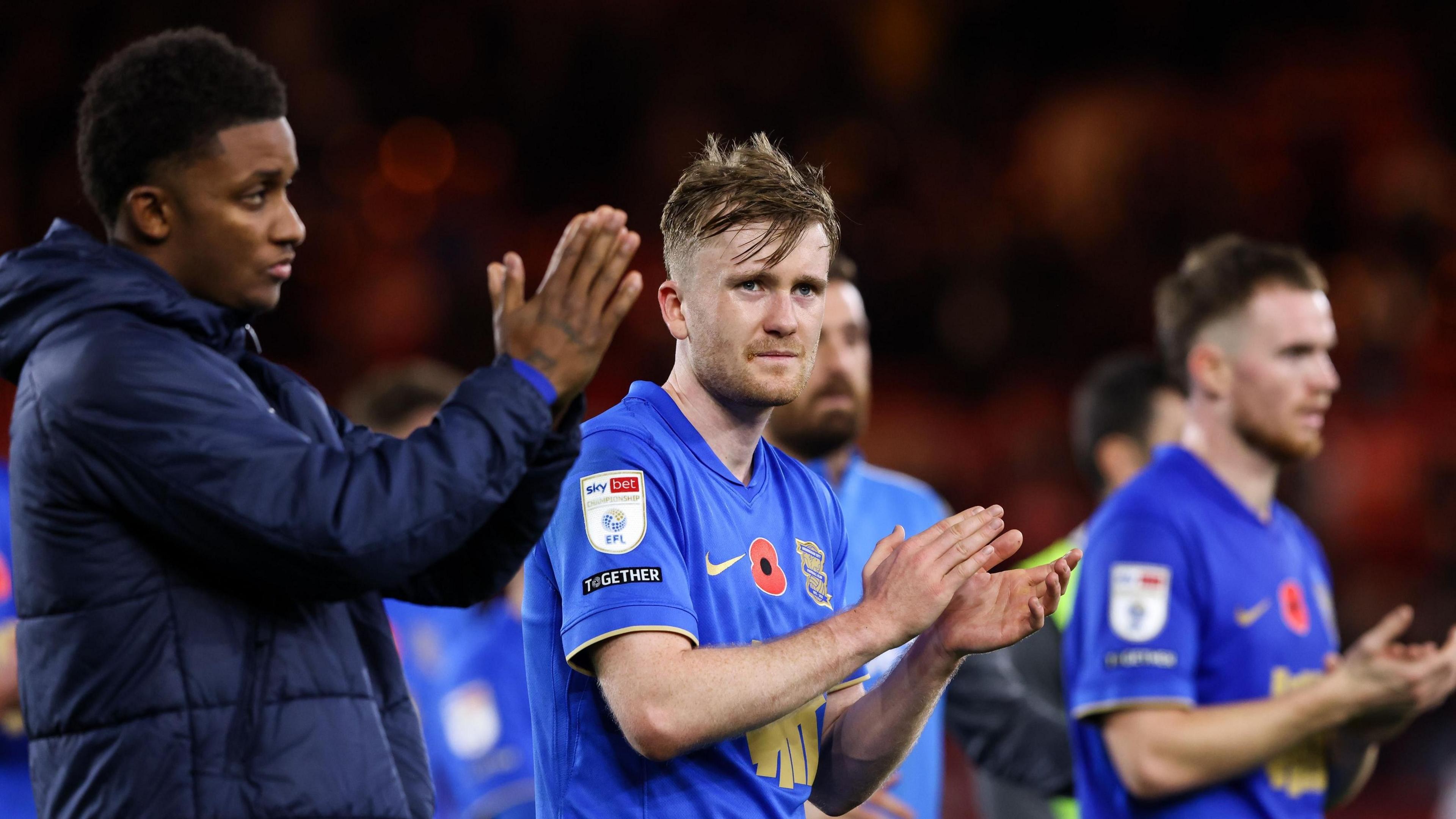 Tommy Doyle (centre) claps the Birmingham City fans after a game