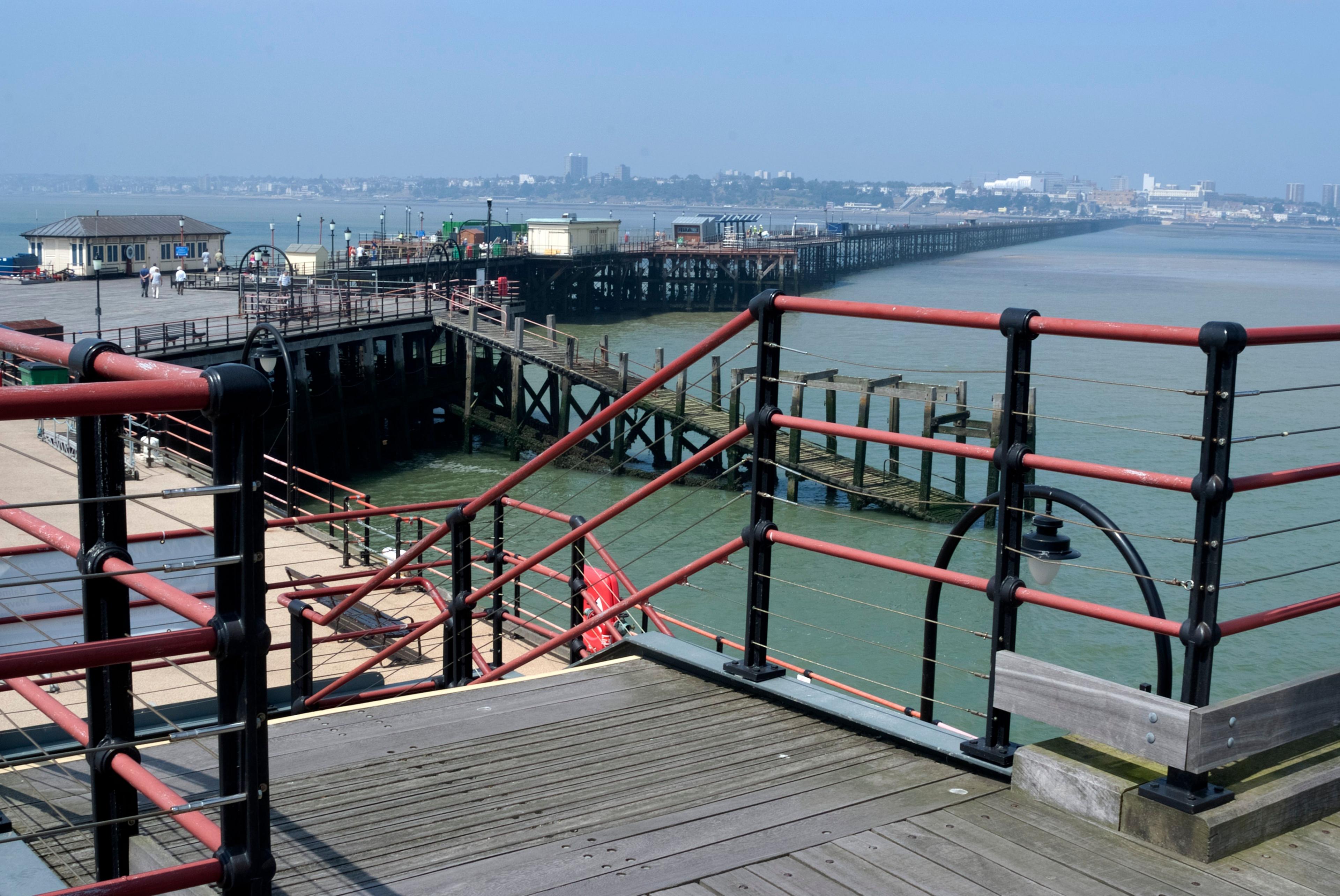 A view of Southend Pier from its end looking down its length to the city