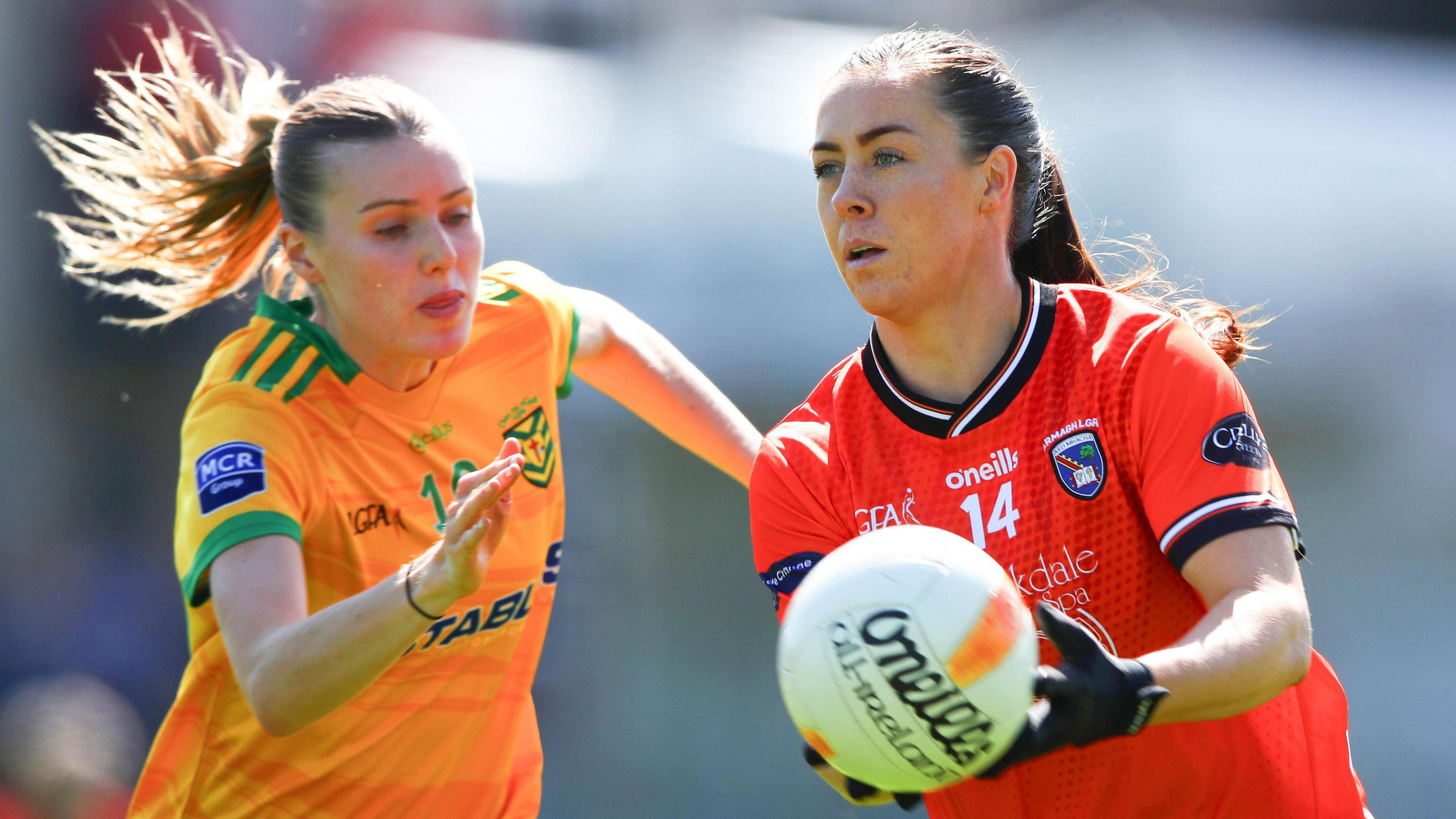 Armagh's Niamh Henderson attempts to burst away from Donegal's Caoimhe Keon at St Tiernach's Park