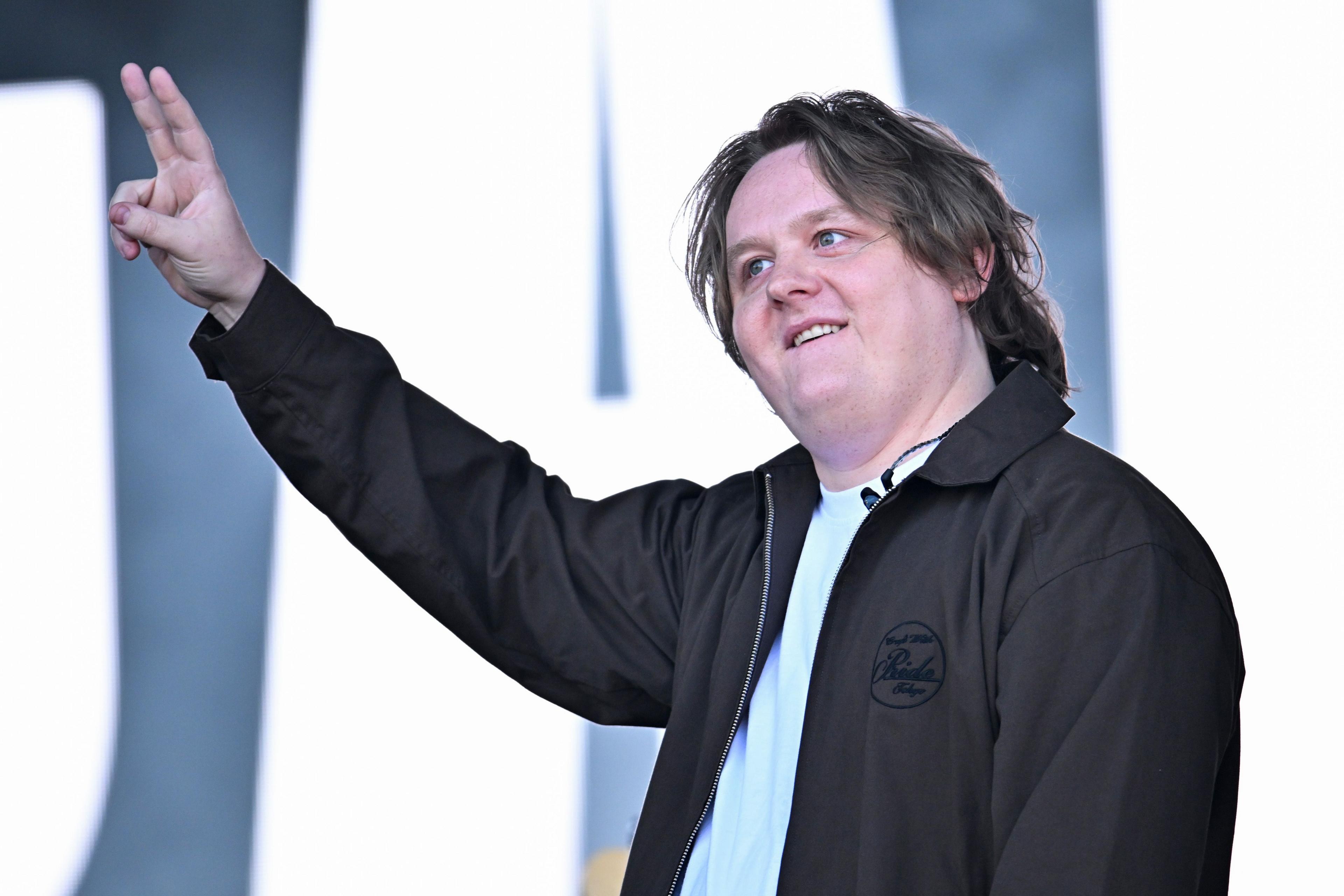 Lewis Capaldi gives the peace sign on stage at Glastonbury