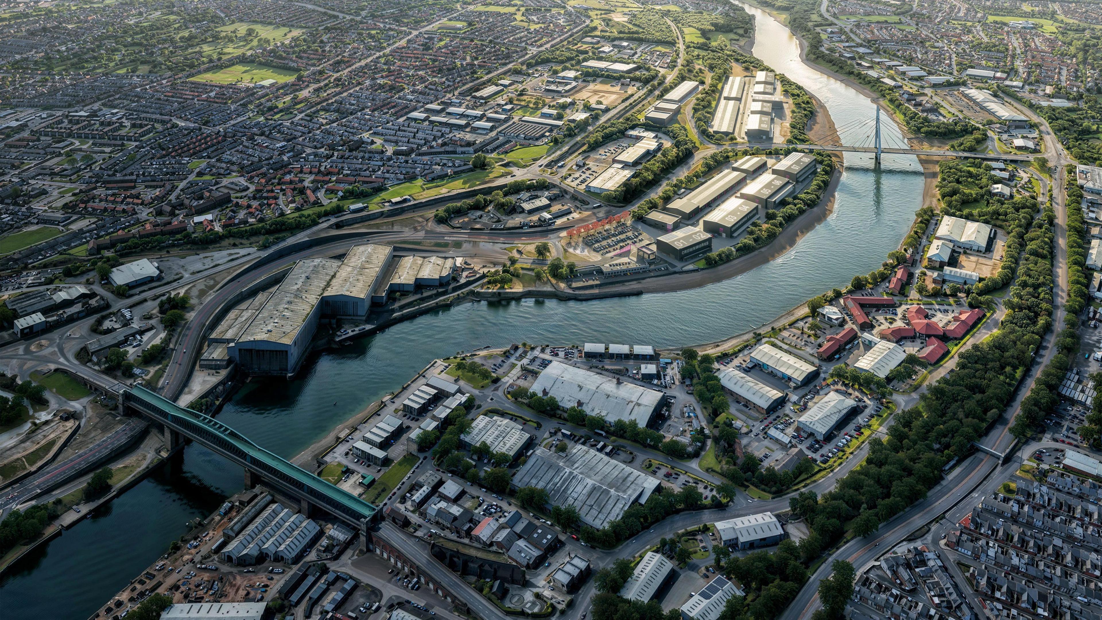An aerial view of how the new film studios could look. The image shows the River Wear curving through the landscape, while new studio buildings sit along its banks.
