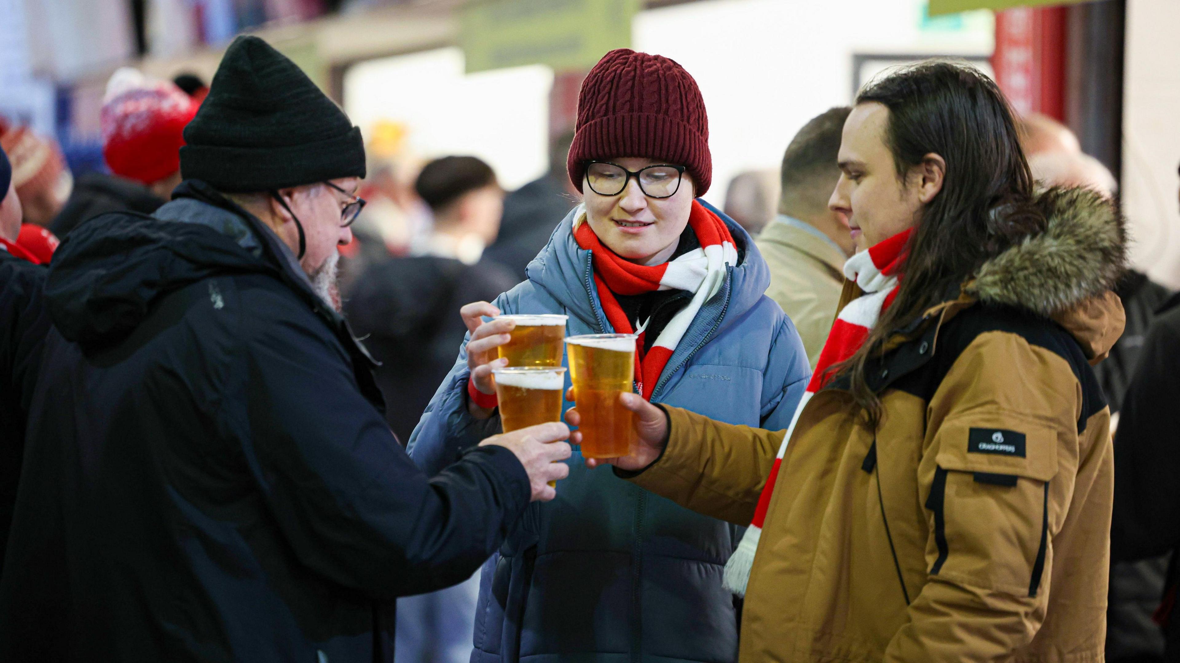 Aberdeen fans with pints of lager last season