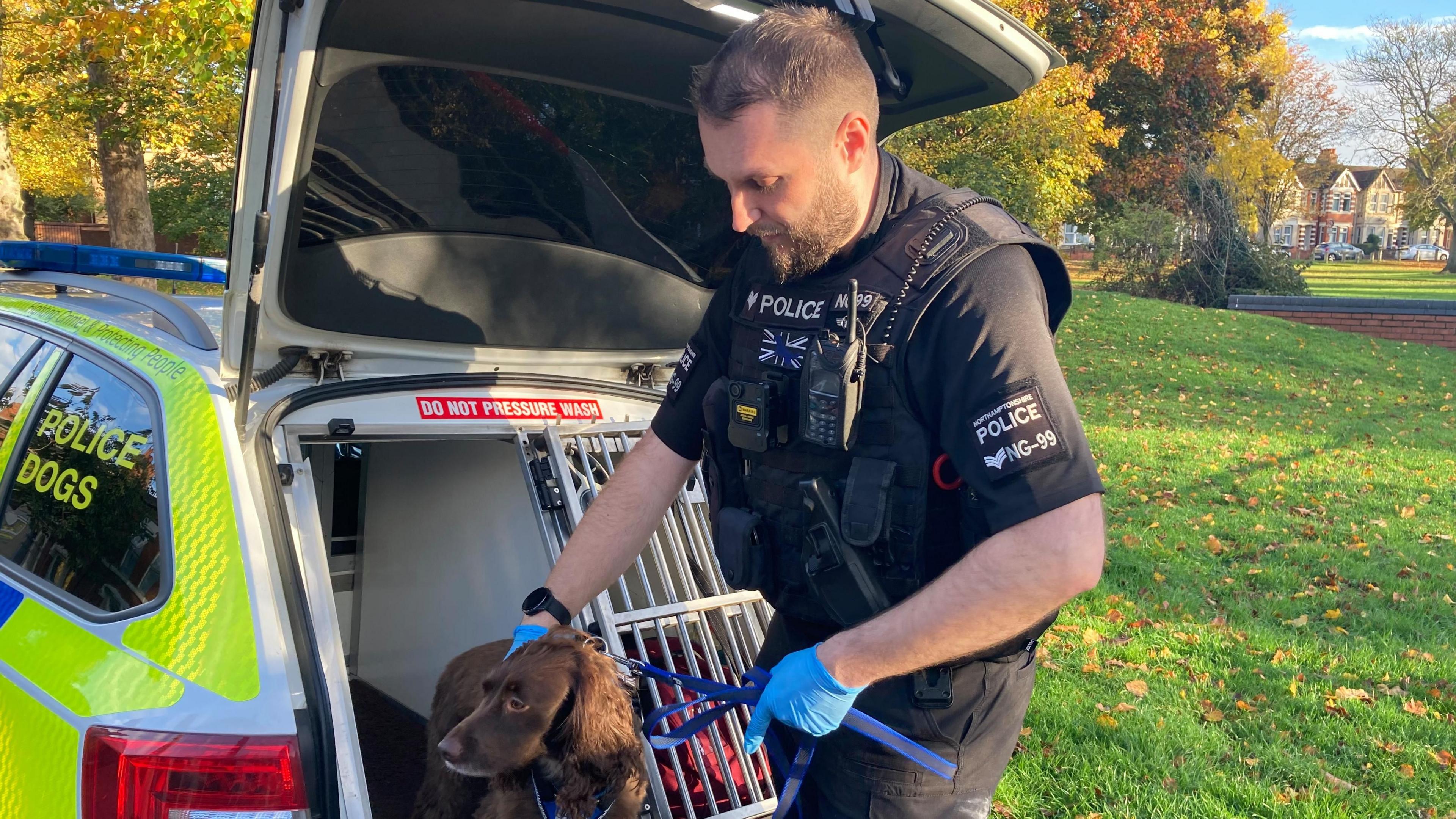 Sgt Chris Monday and PD Bonnie getting out the police car