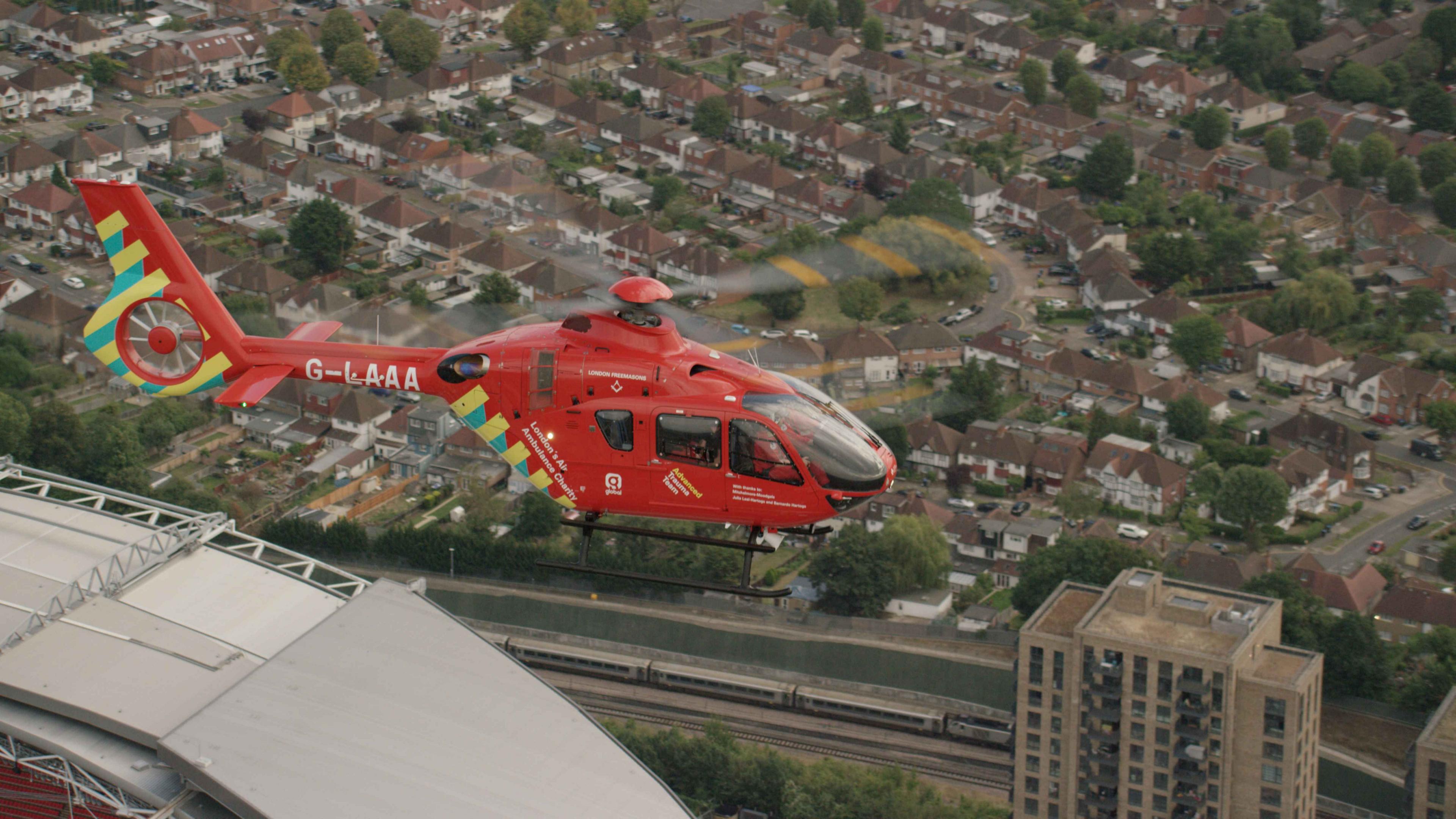 H135 helicopter flying over wembley stadium