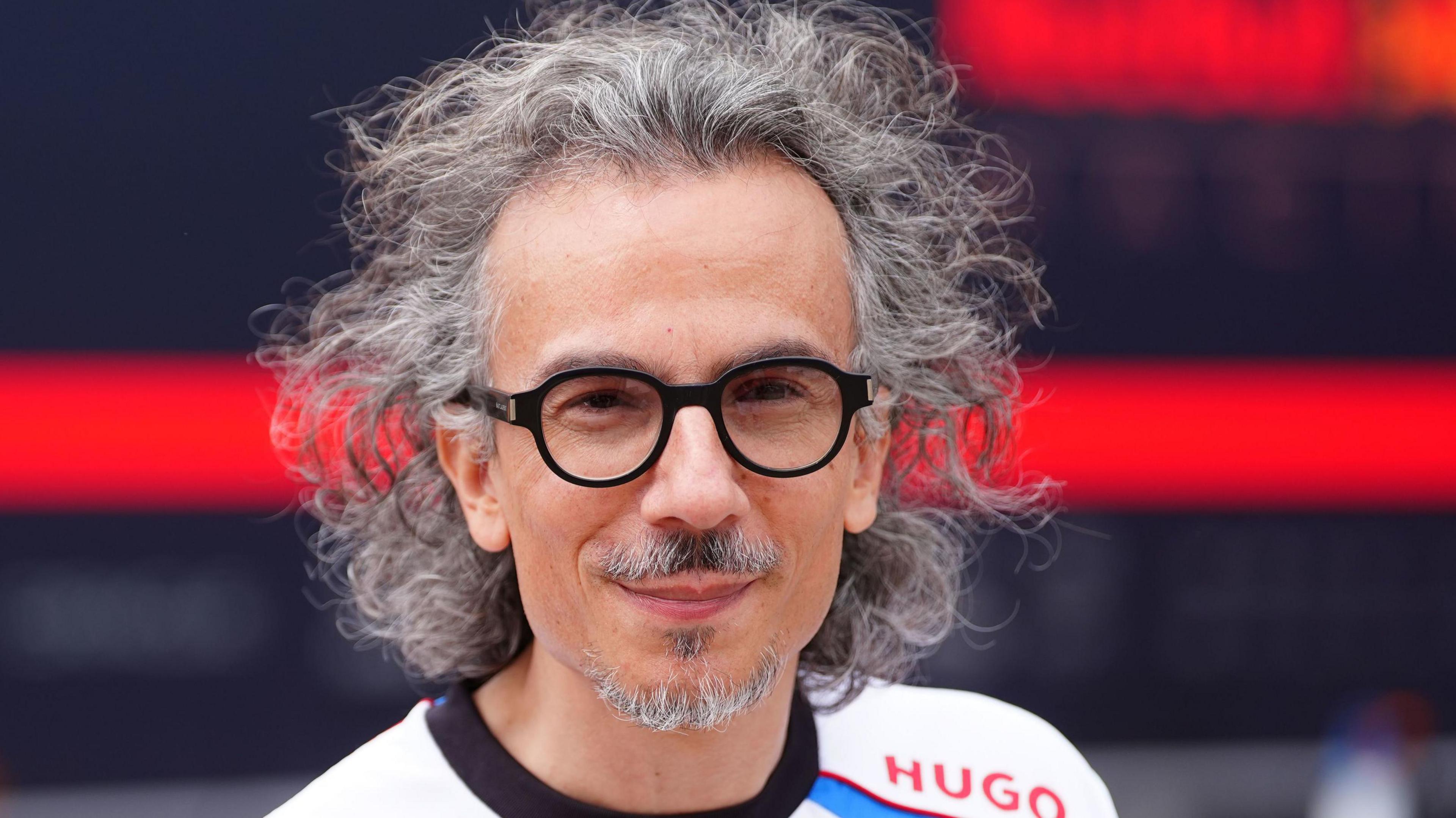 Laurent Mekies pictured astatine nan 2025 British Grand Prix wearing a Racing Bulls T-shirt