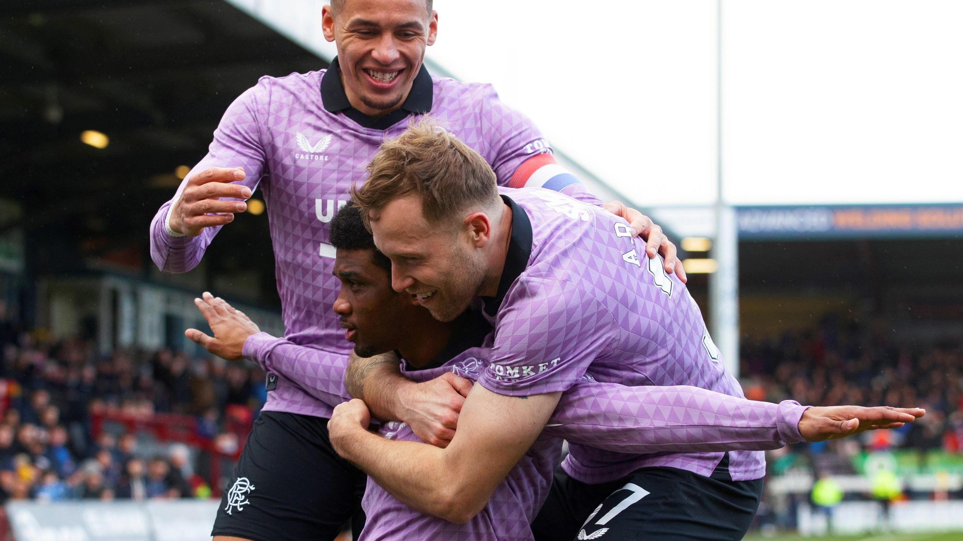 Diallo celebrates with Scott Arfield after his goal at Ross County