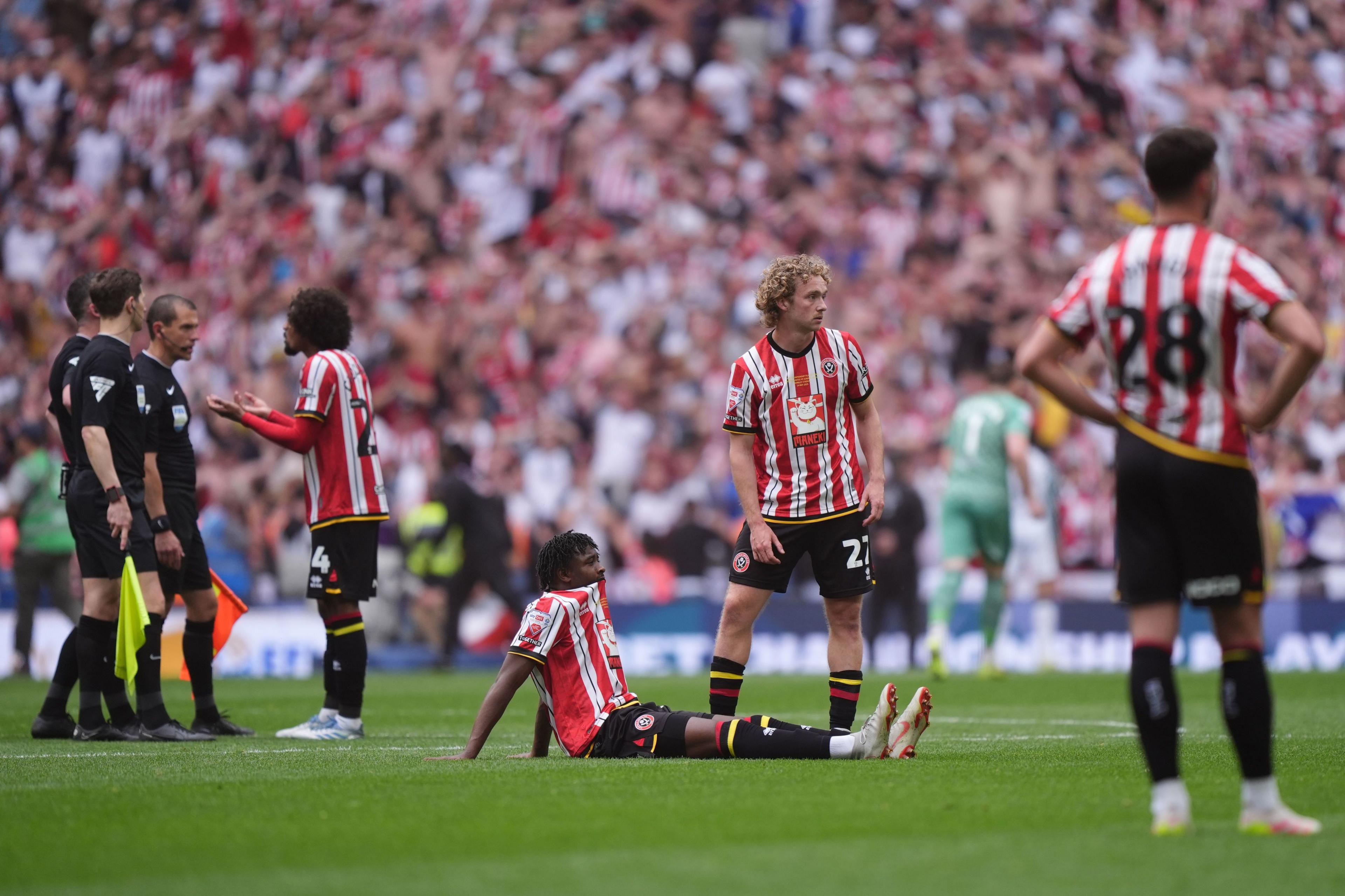 Sheffield United players look dejected at full-time in the play-off final