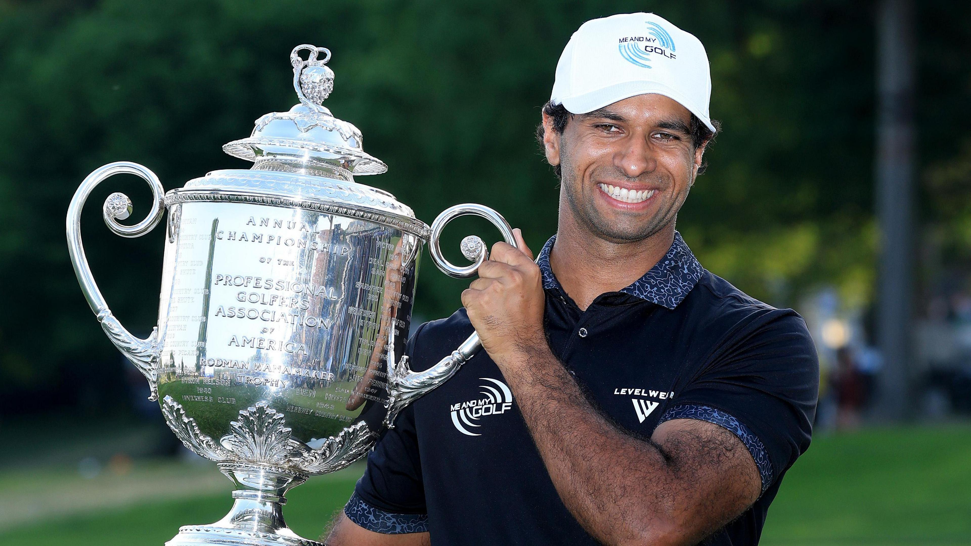 Aaron Rai lifts the Wanamaker Trophy