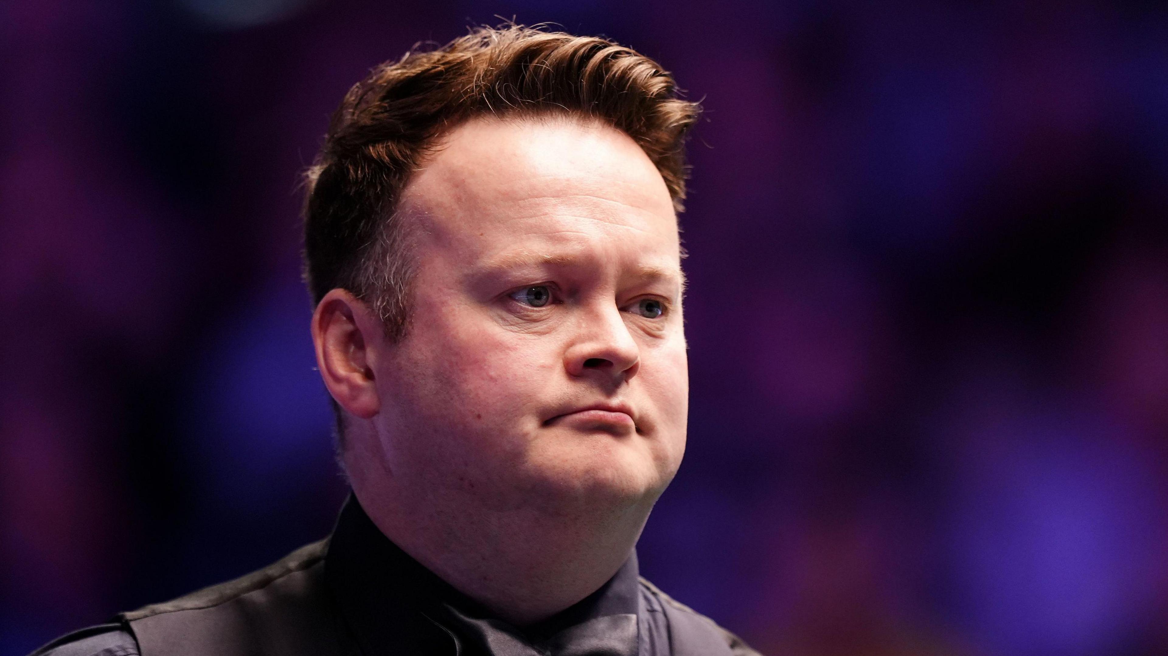 Shaun Murphy looks across the table