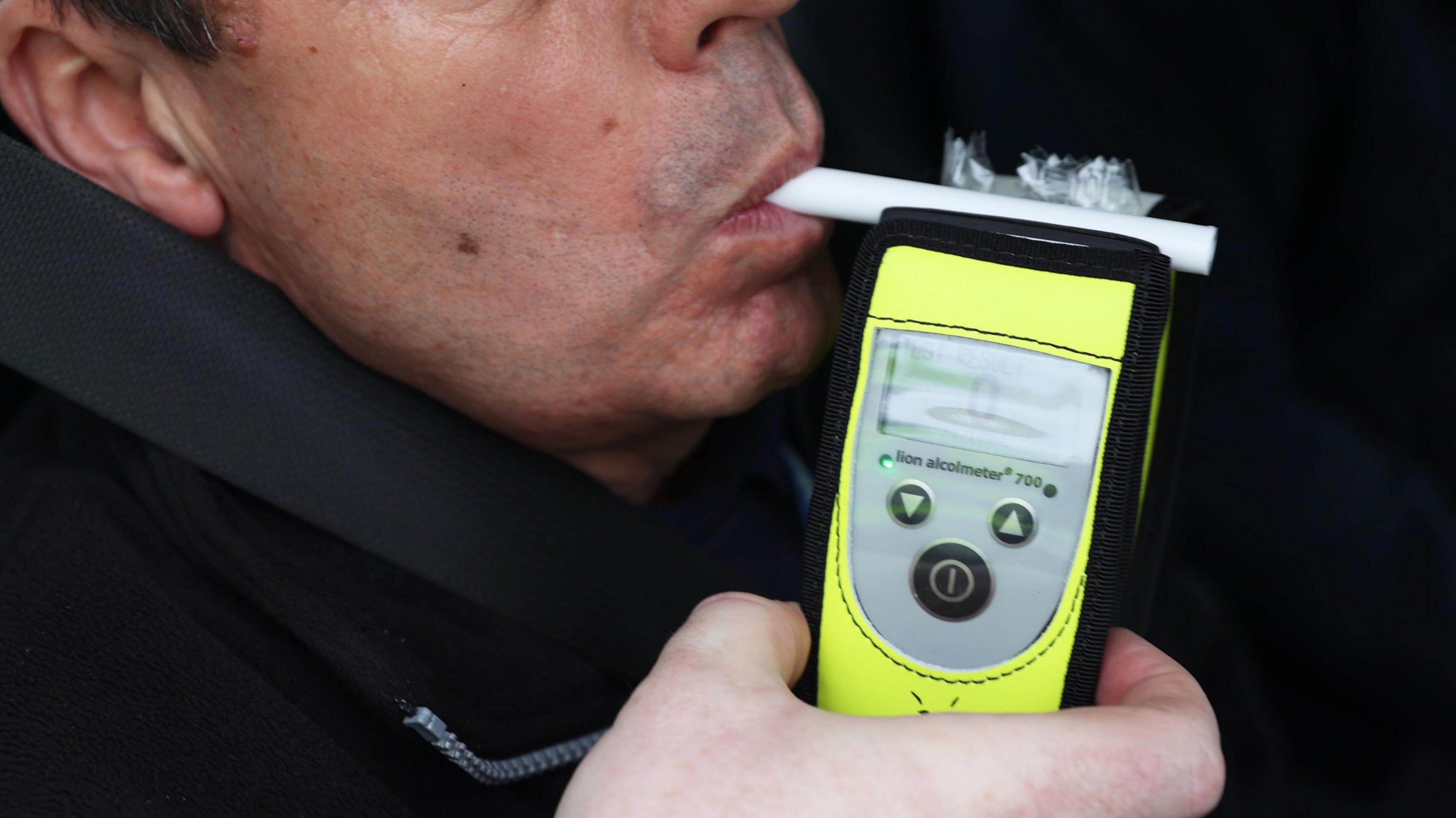 Man being breathalysed