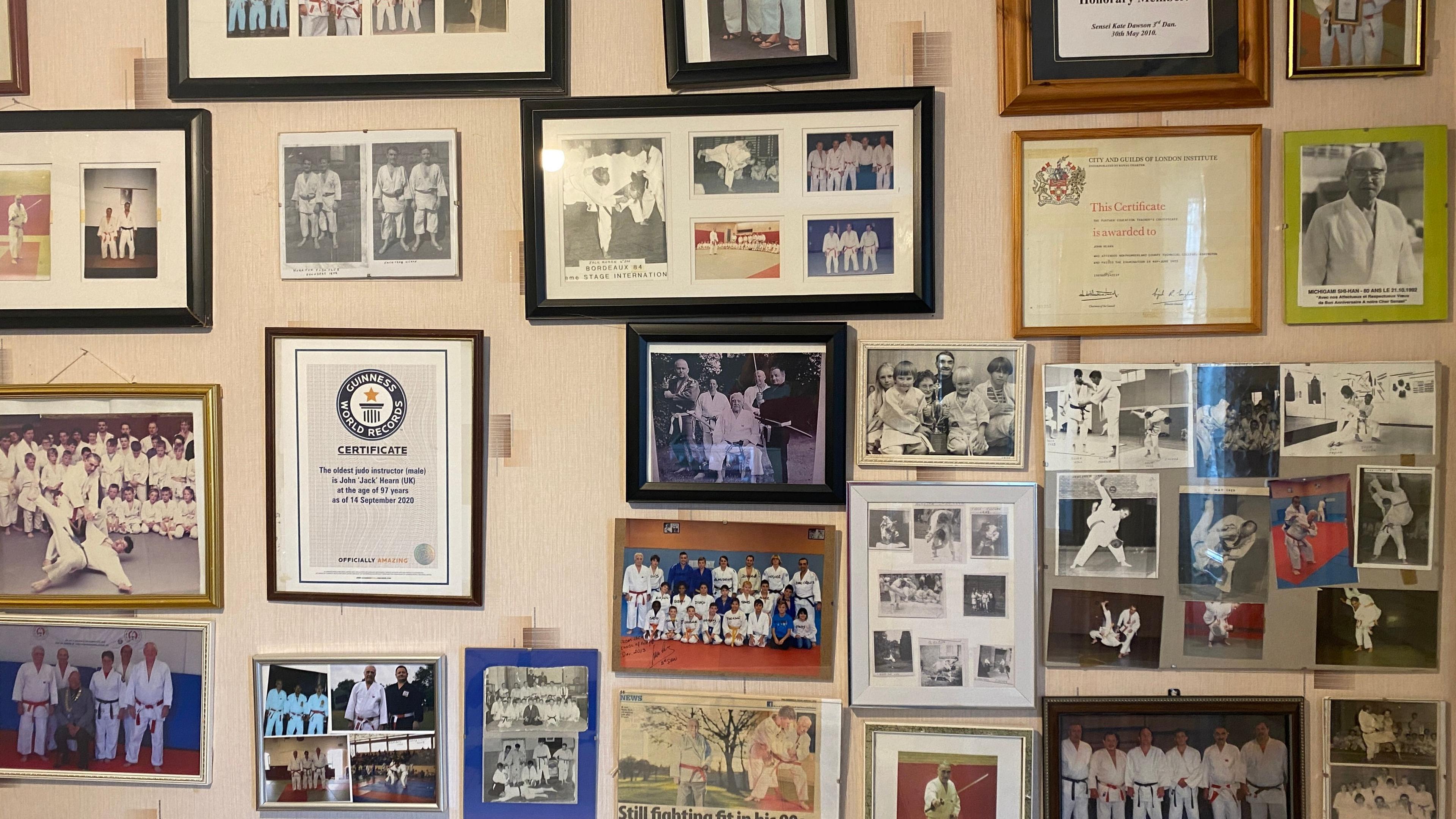 Jack Hearn's kitchen wall full of certificates 