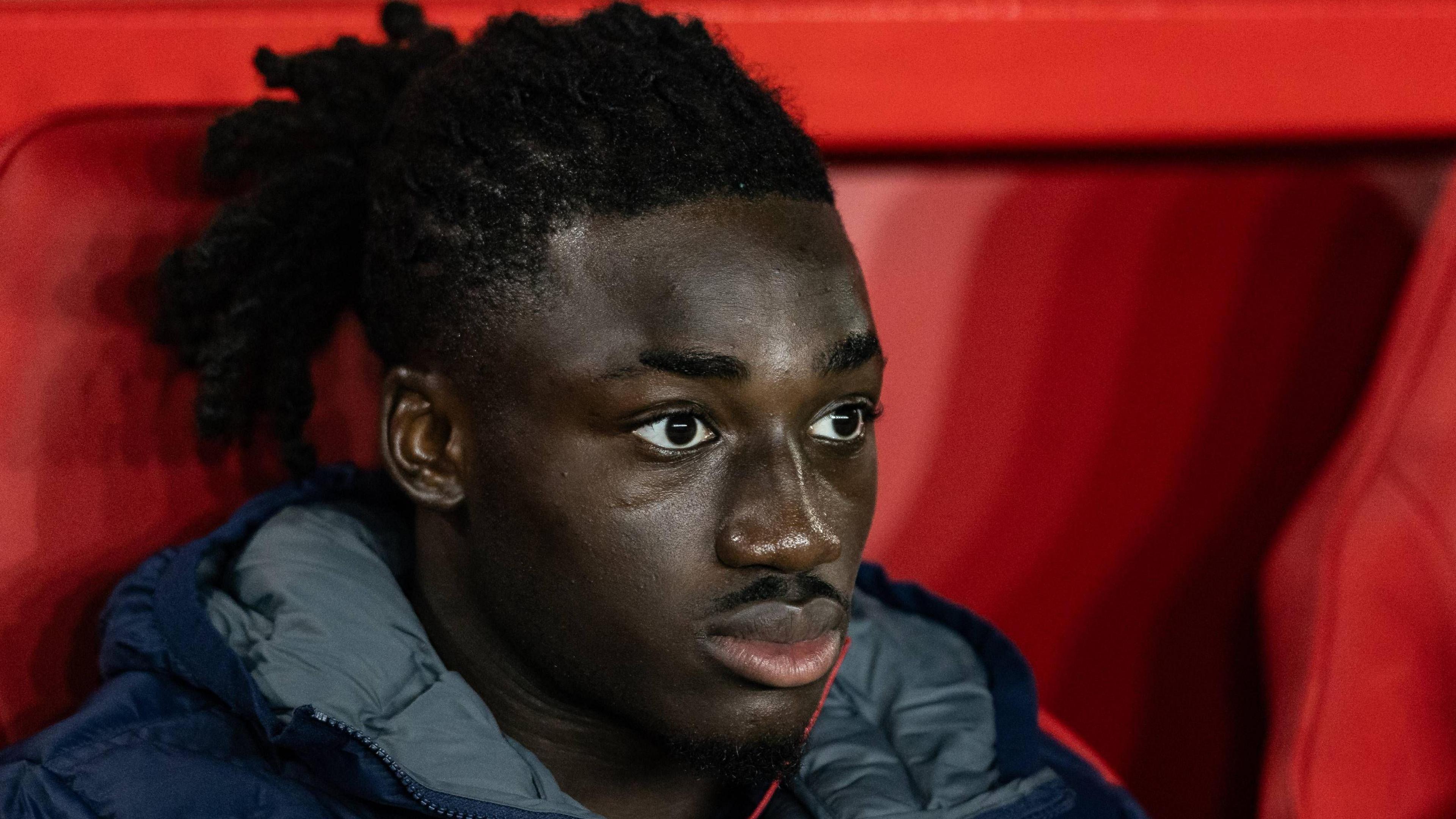 Crystal Palace Football Club player Asher Agbinone sitting on the bench at Nottingham Forest