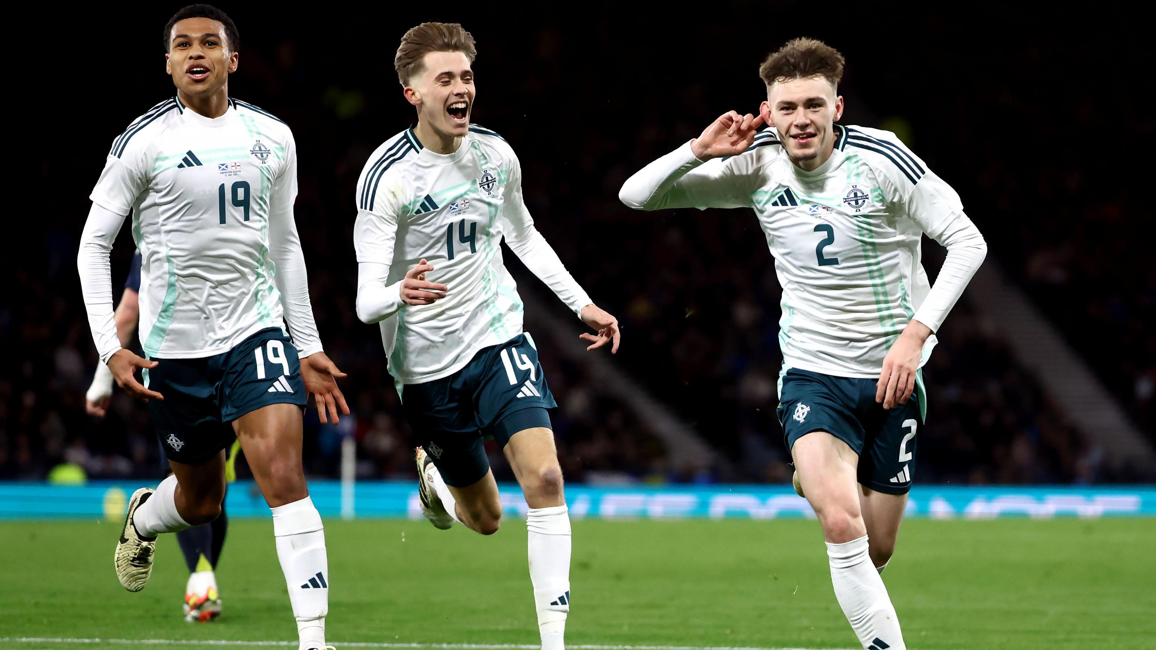 Shea Charles, Isaac Price and Conor Bradley celebrate
