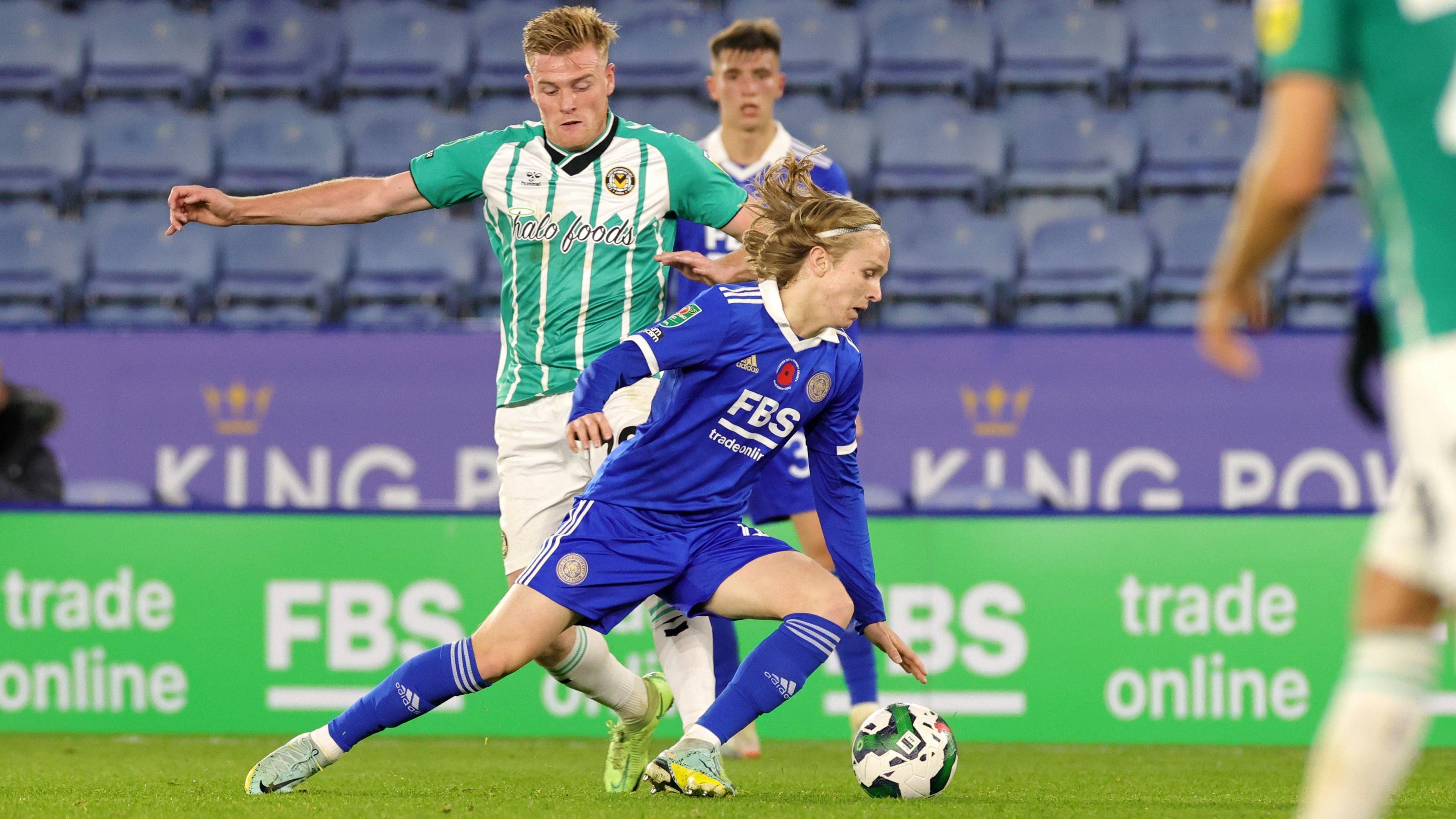 Sammy Braybrooke jinks past Will Evans in Leicester's League Cup win against Newport County