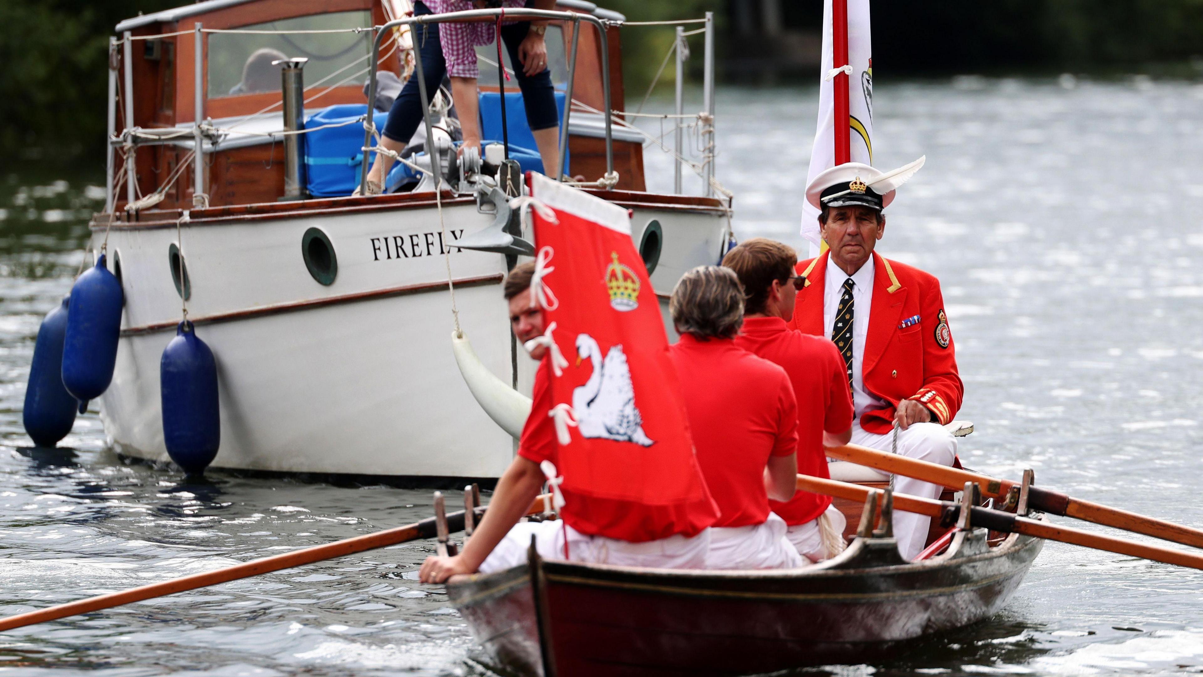 People in rowing boat during the swan upping count in July 2024