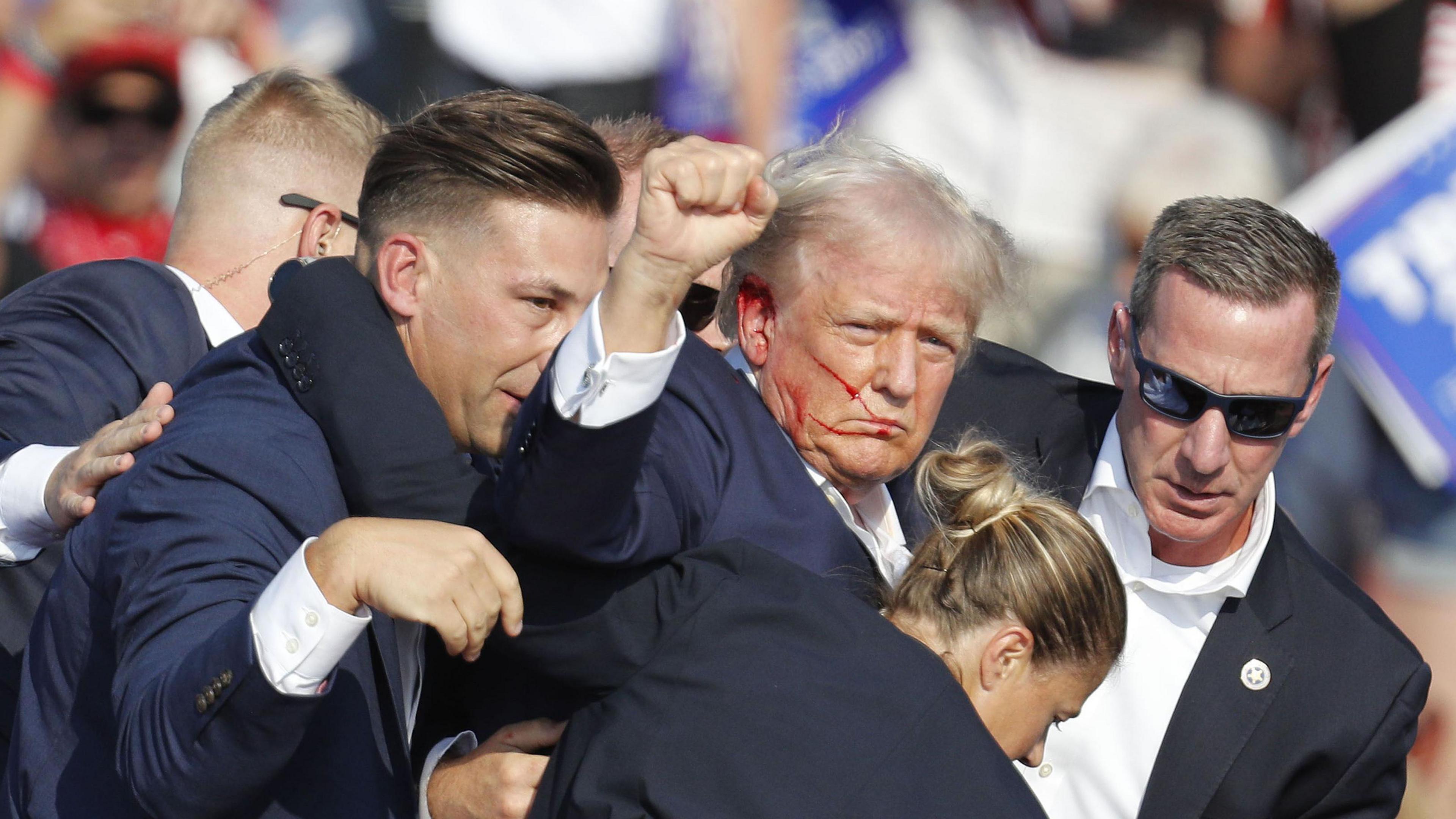 Former US President Donald Trump is rushed off stage by secret service after an incident during a campaign rally at the Butler Farm Show Inc. in Butler, Pennsylvania, USA, 13 July 2024. 