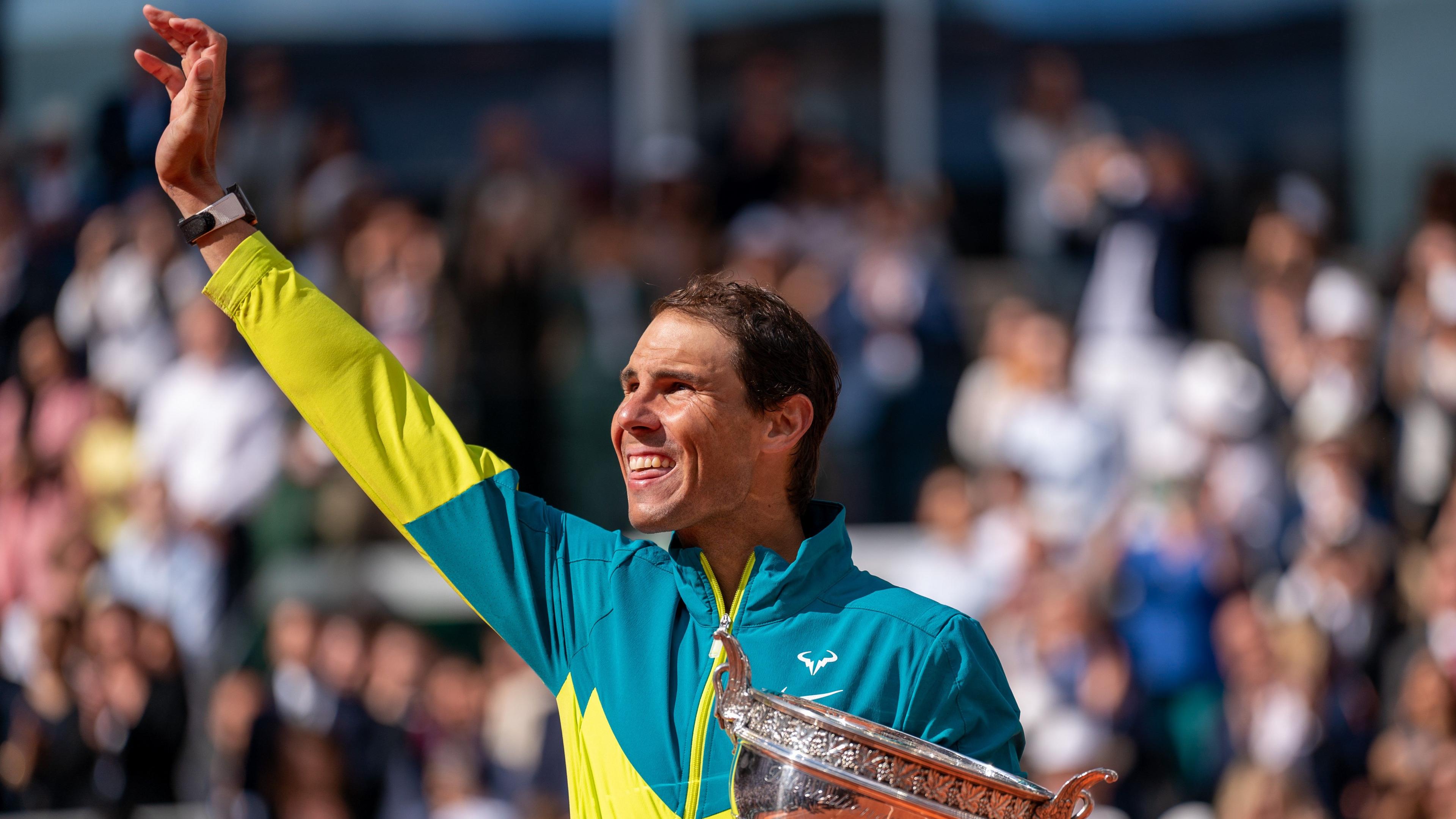 Rafael Nadal waves to the crowd at the 2022 French Open