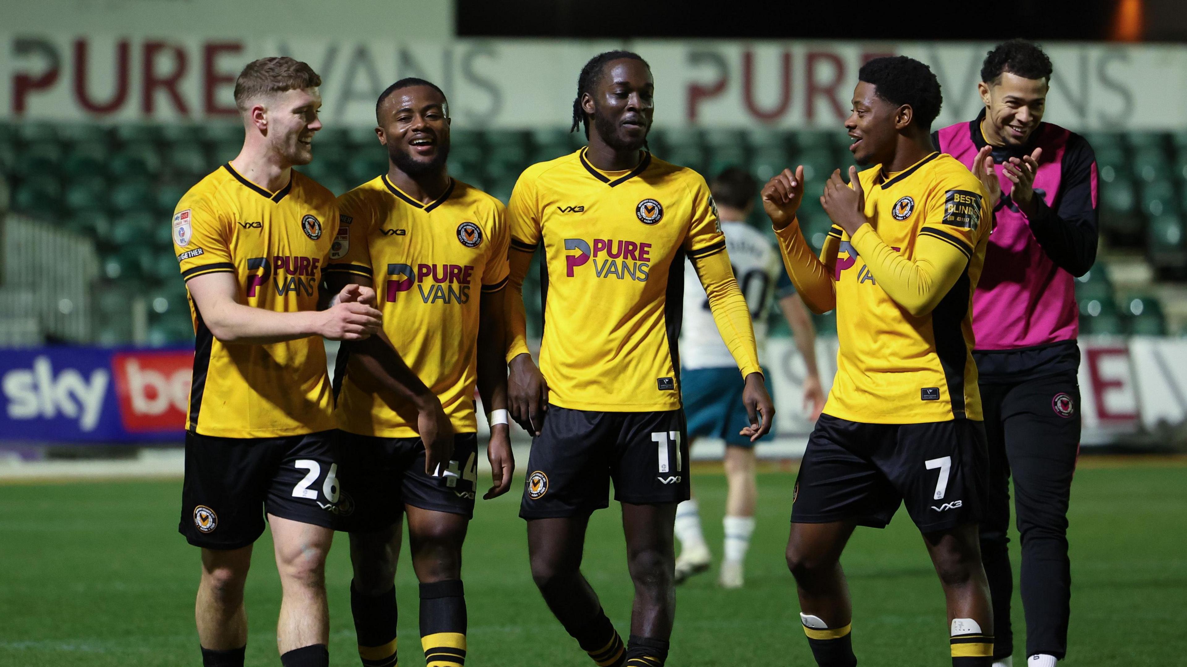 Cameron Evans of Newport County, David Ajiboye of Newport County, Cameron Antwi of Newport County and Bobby Kamwa of Newport County at the end of the match against Morecambe. 