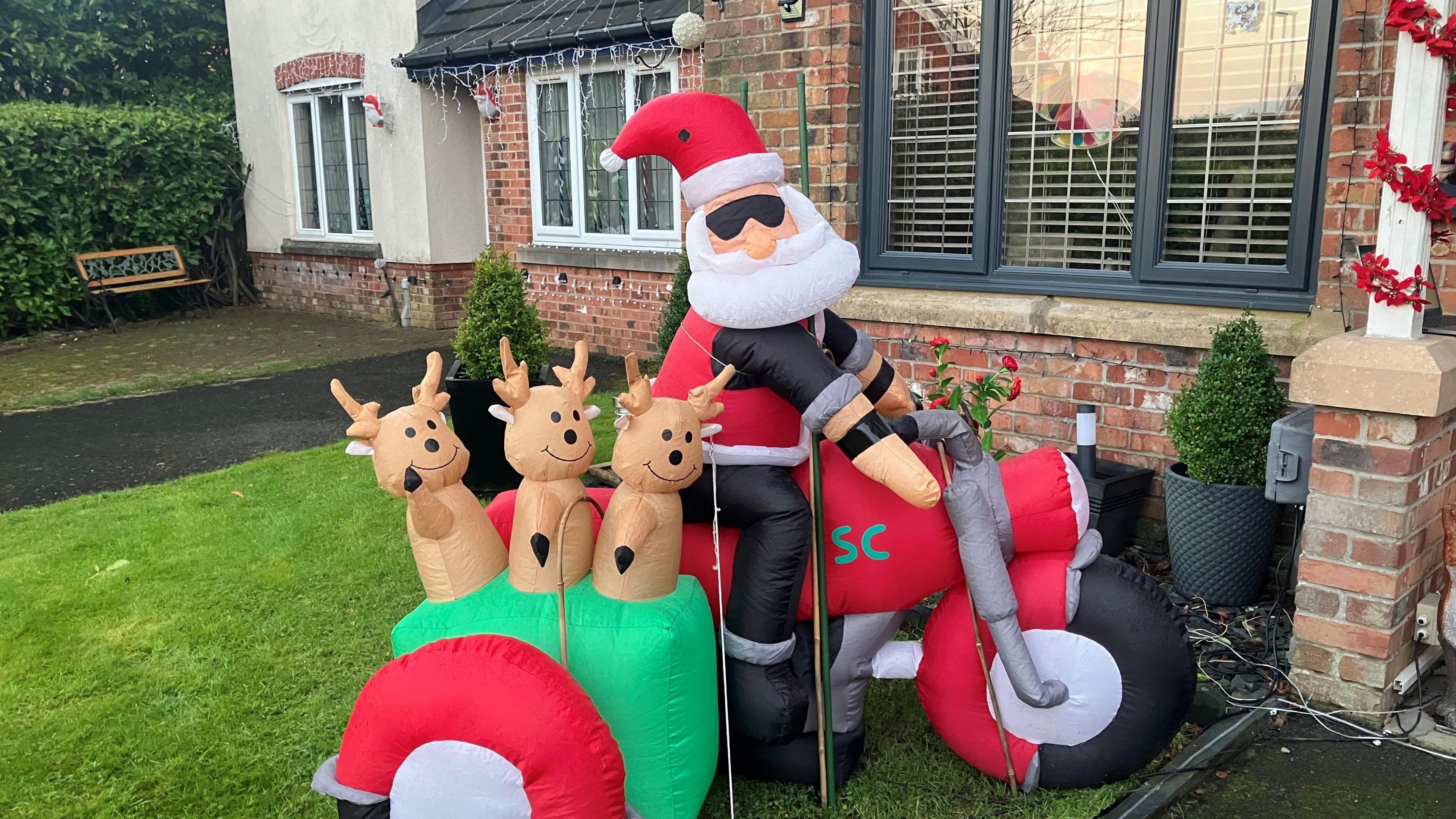 Photograph of an inflatable Christmas decoration on a road in Rochdale 