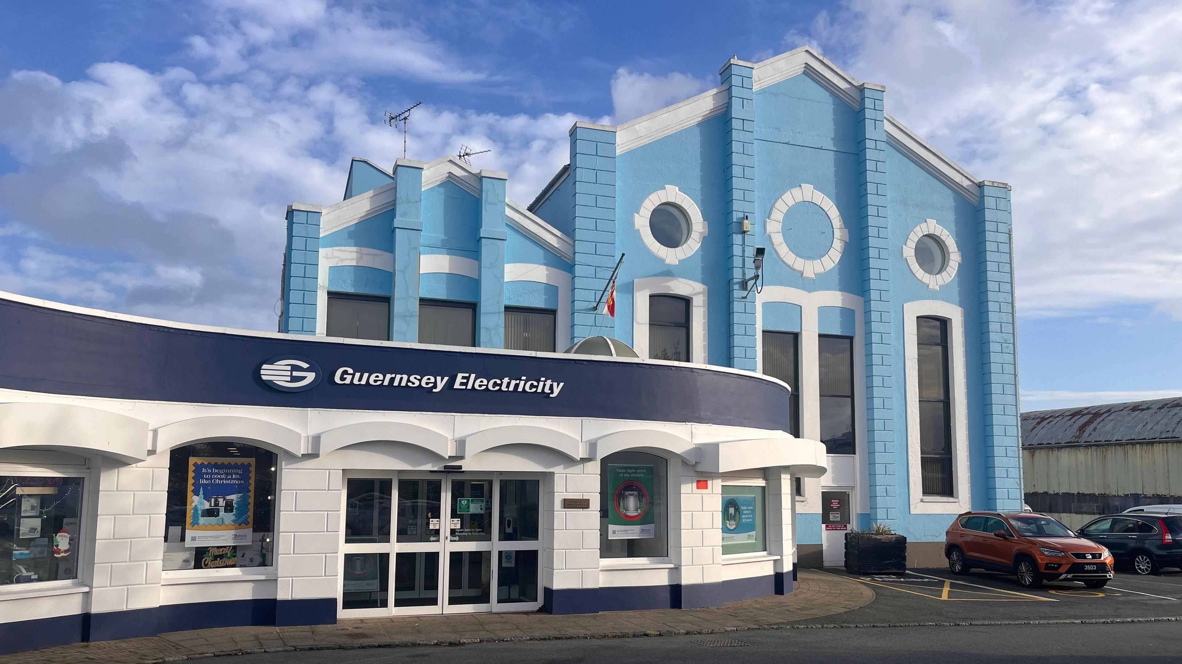 A blue and white Guernsey Electricity building.