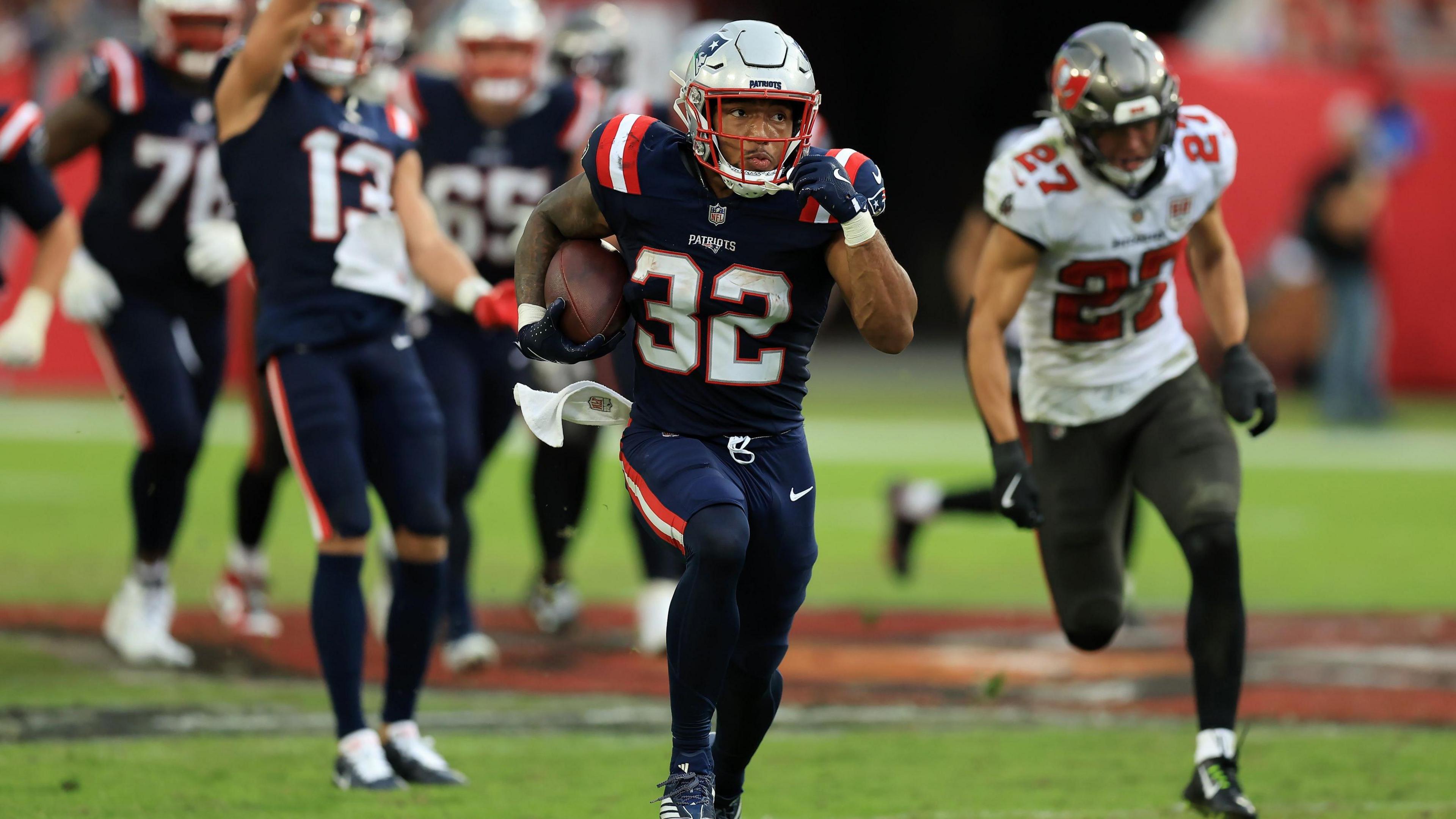 TreVeyon Henderson pictured running with the ball for the New England Patriots against the Tampa Bay Buccaneers