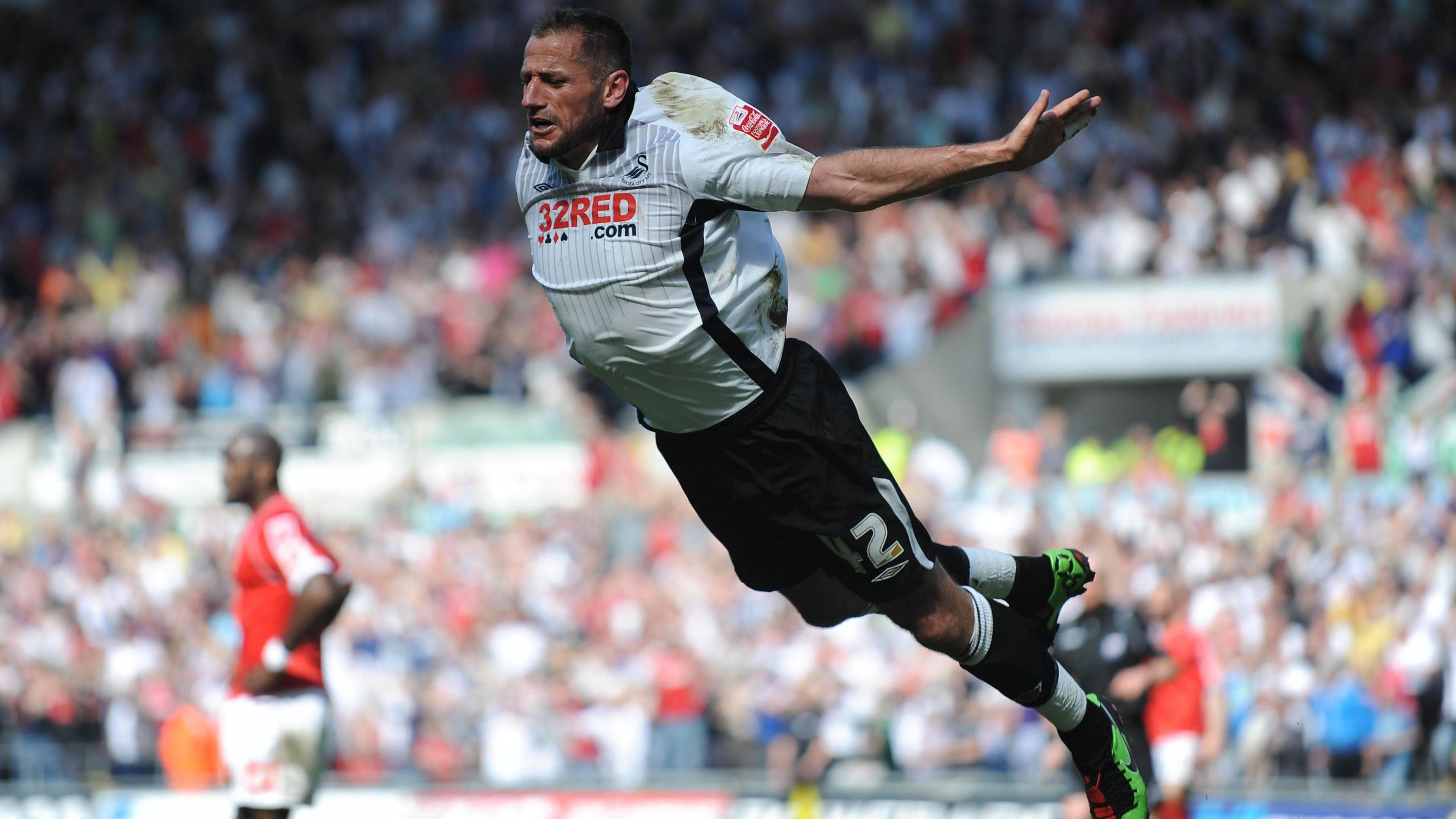 Shefki Kuqi celebrates a Swansea goal against Barnsley in October 2010 