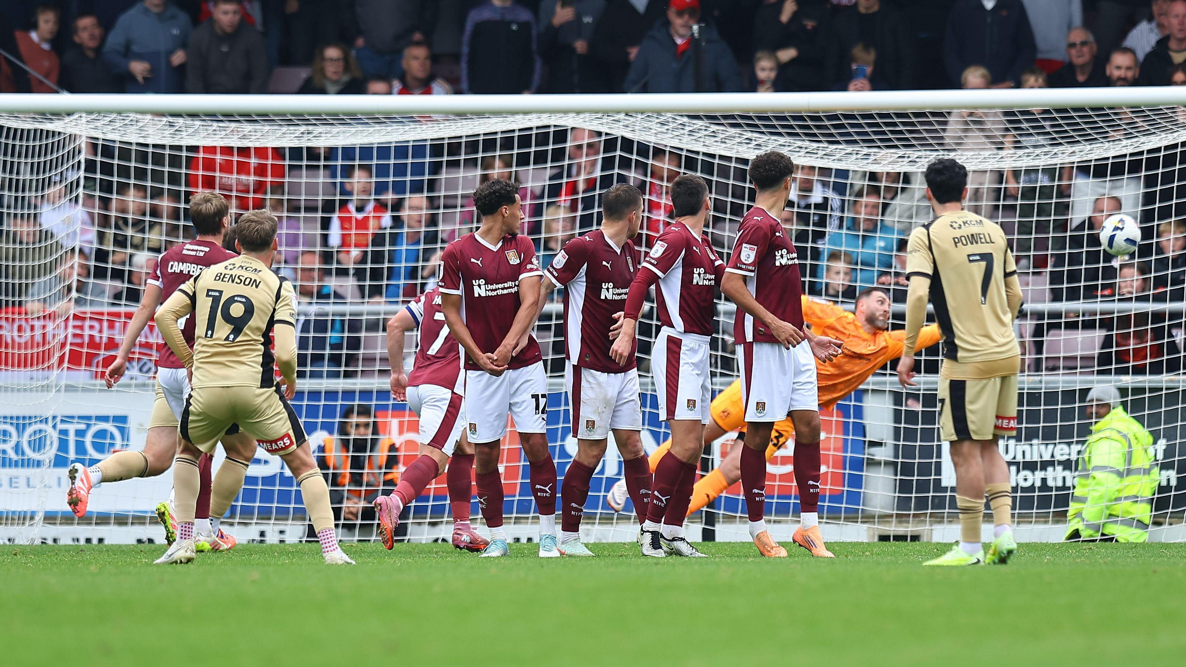 Josh Benson bends his free-kick around the wall and into the top corner