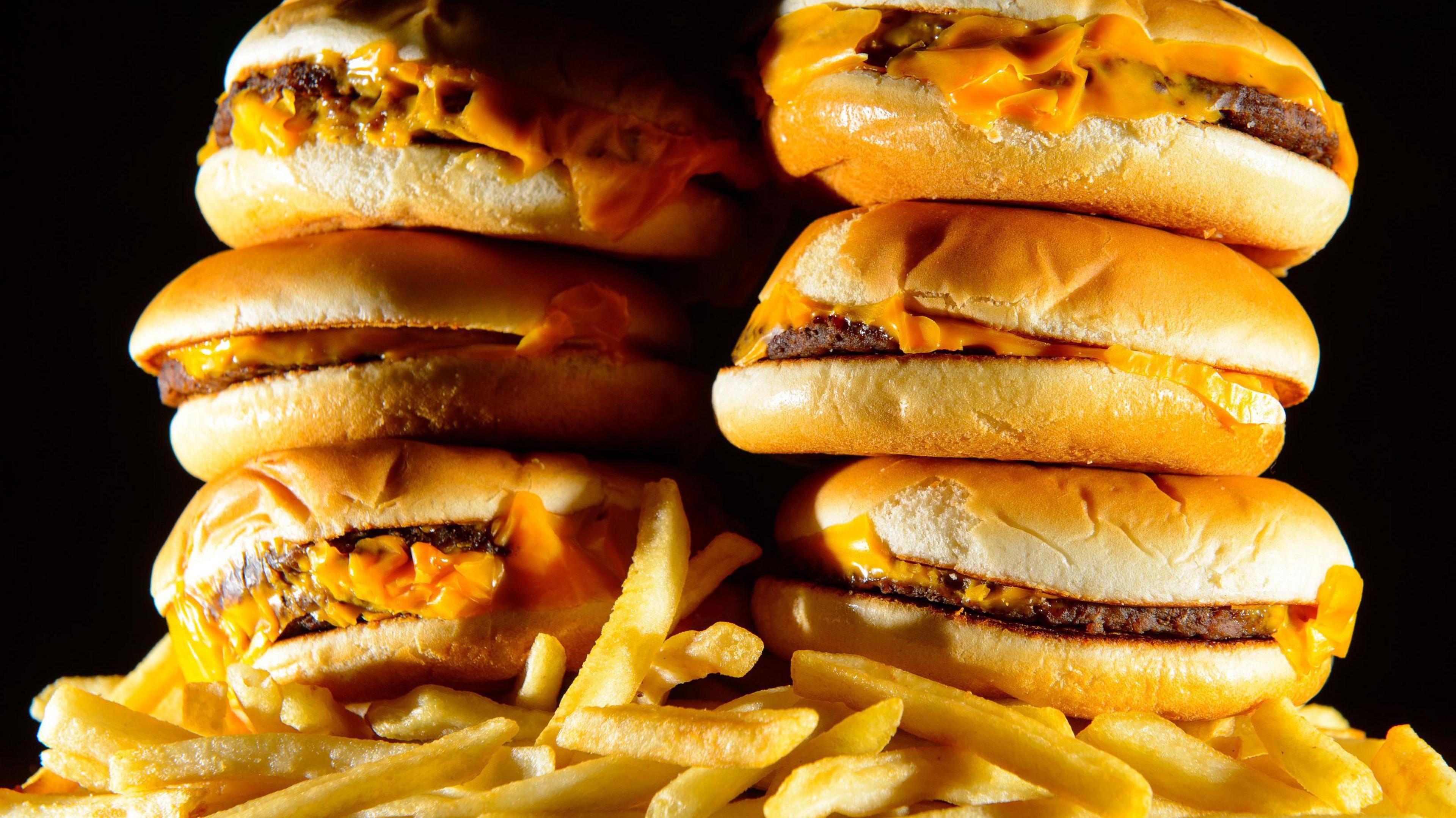 Stock image of cheeseburgers and chips