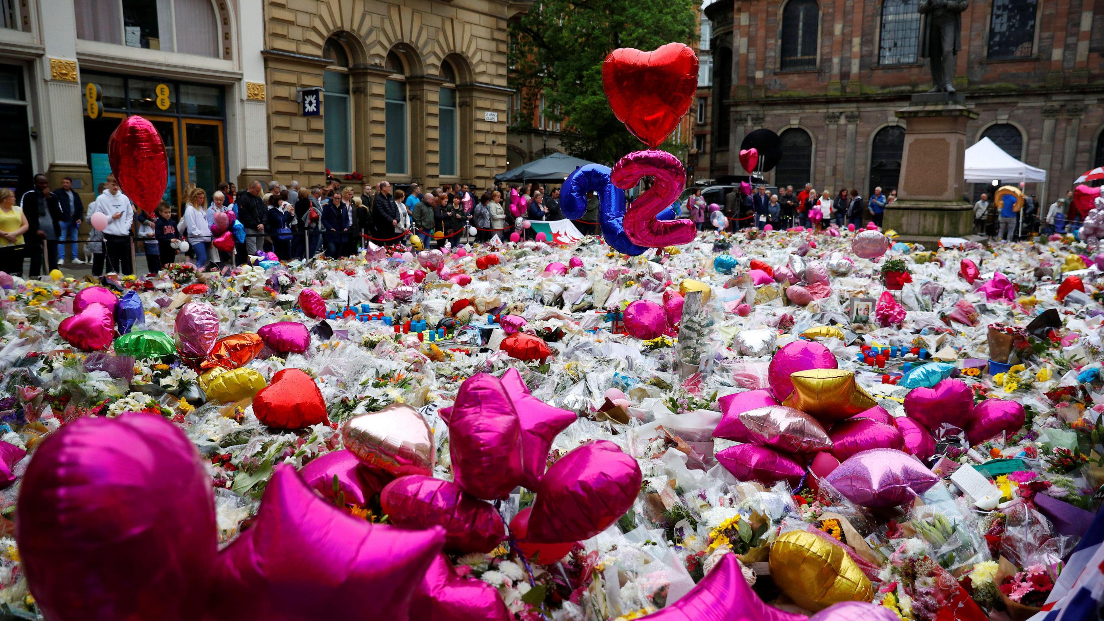 Flowers and tributes to the victims of the attack on Manchester Arena fill St Ann"s Square in Manchester, Britain, May 29,