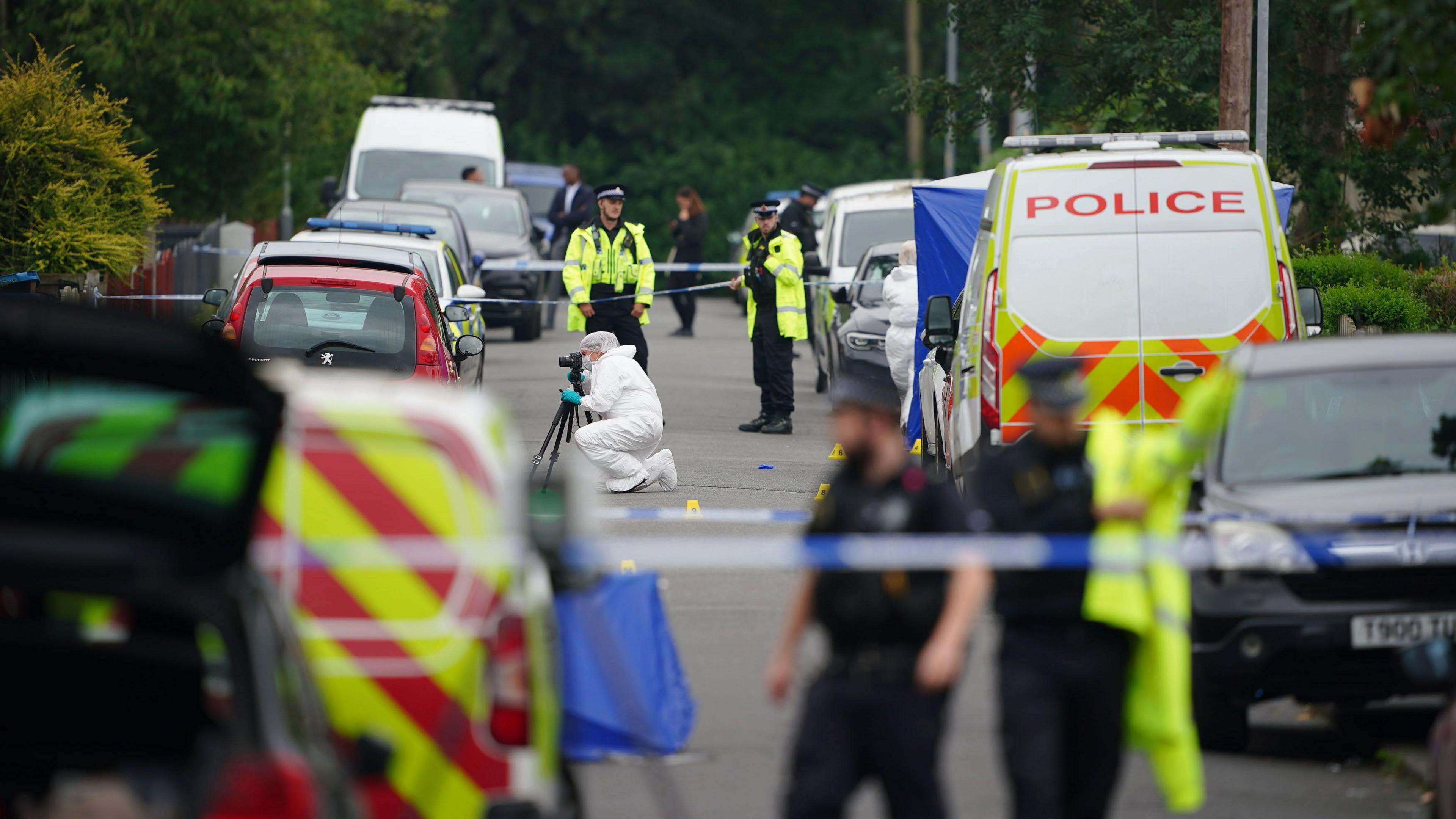 A police van and forensic team along with officers on Barnard Road