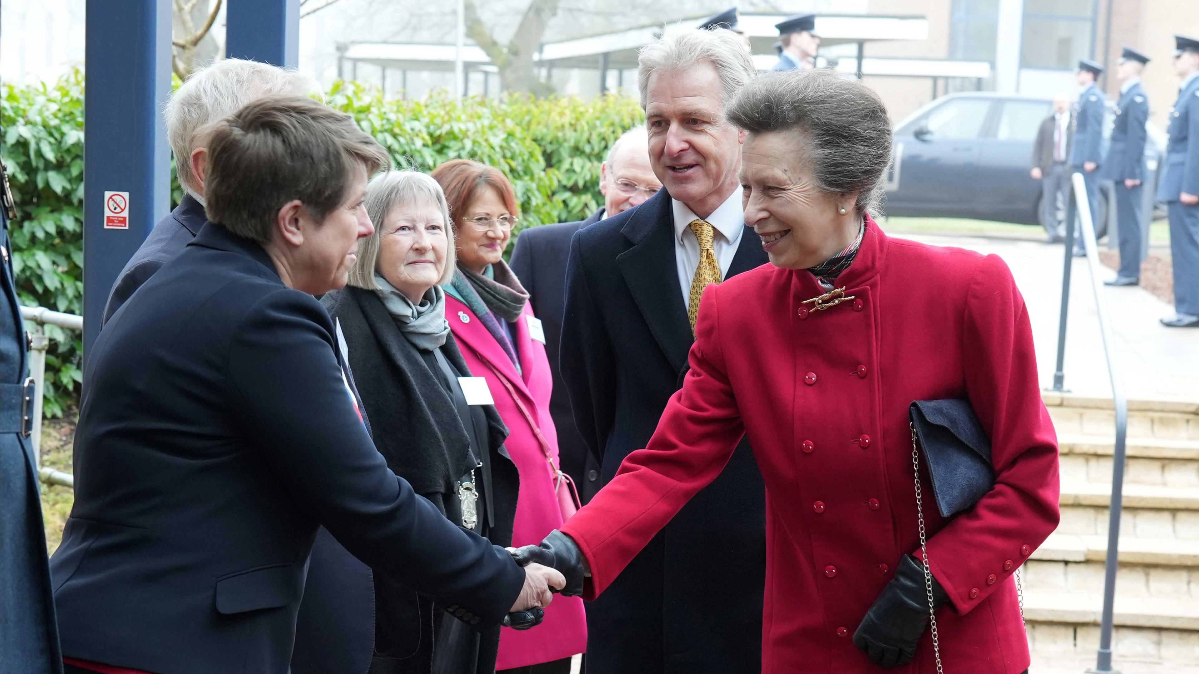 A photo of The Princess Royal arriving and greeting workers at the Fire Station College