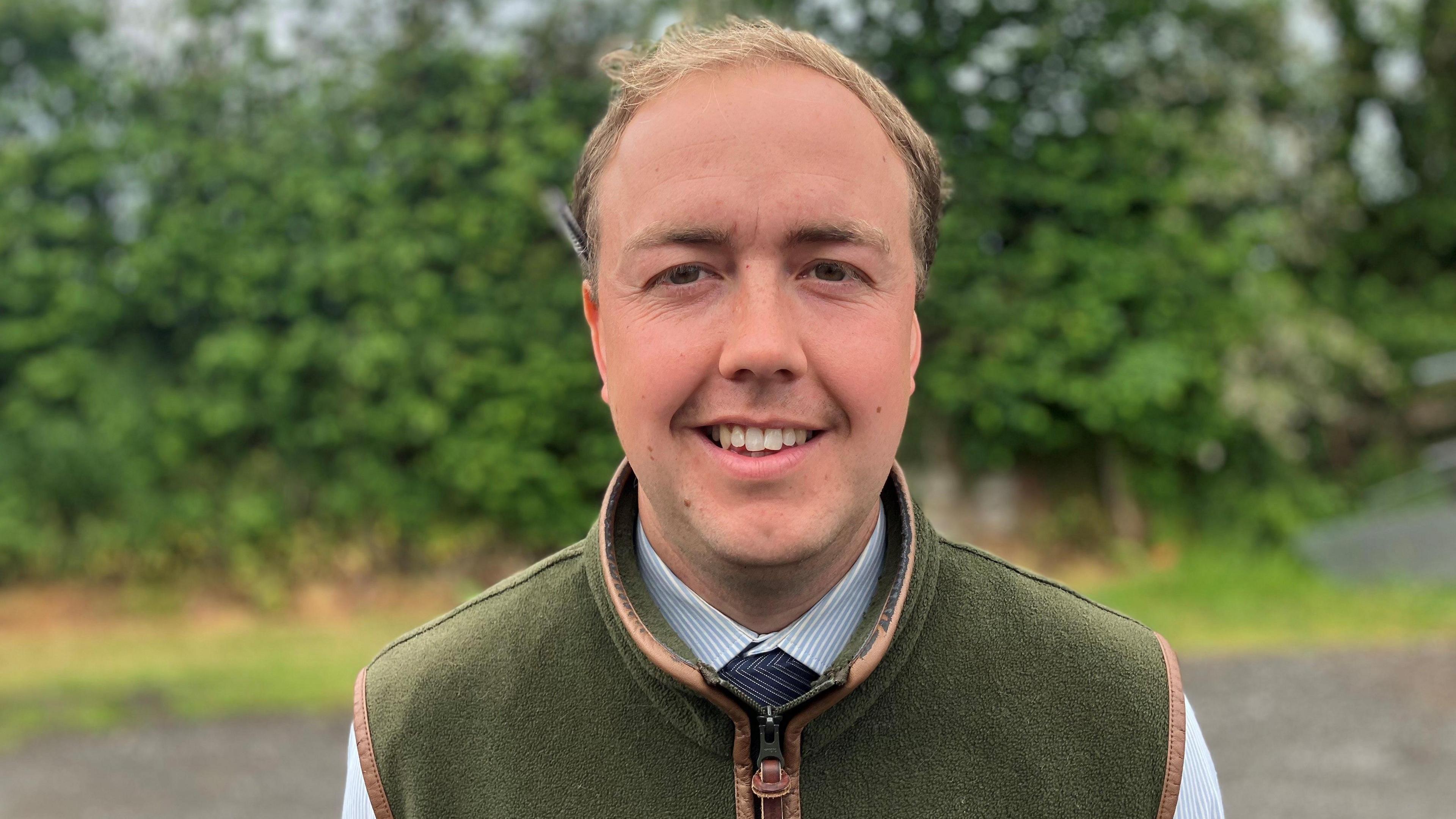 Man wearing a green gilet