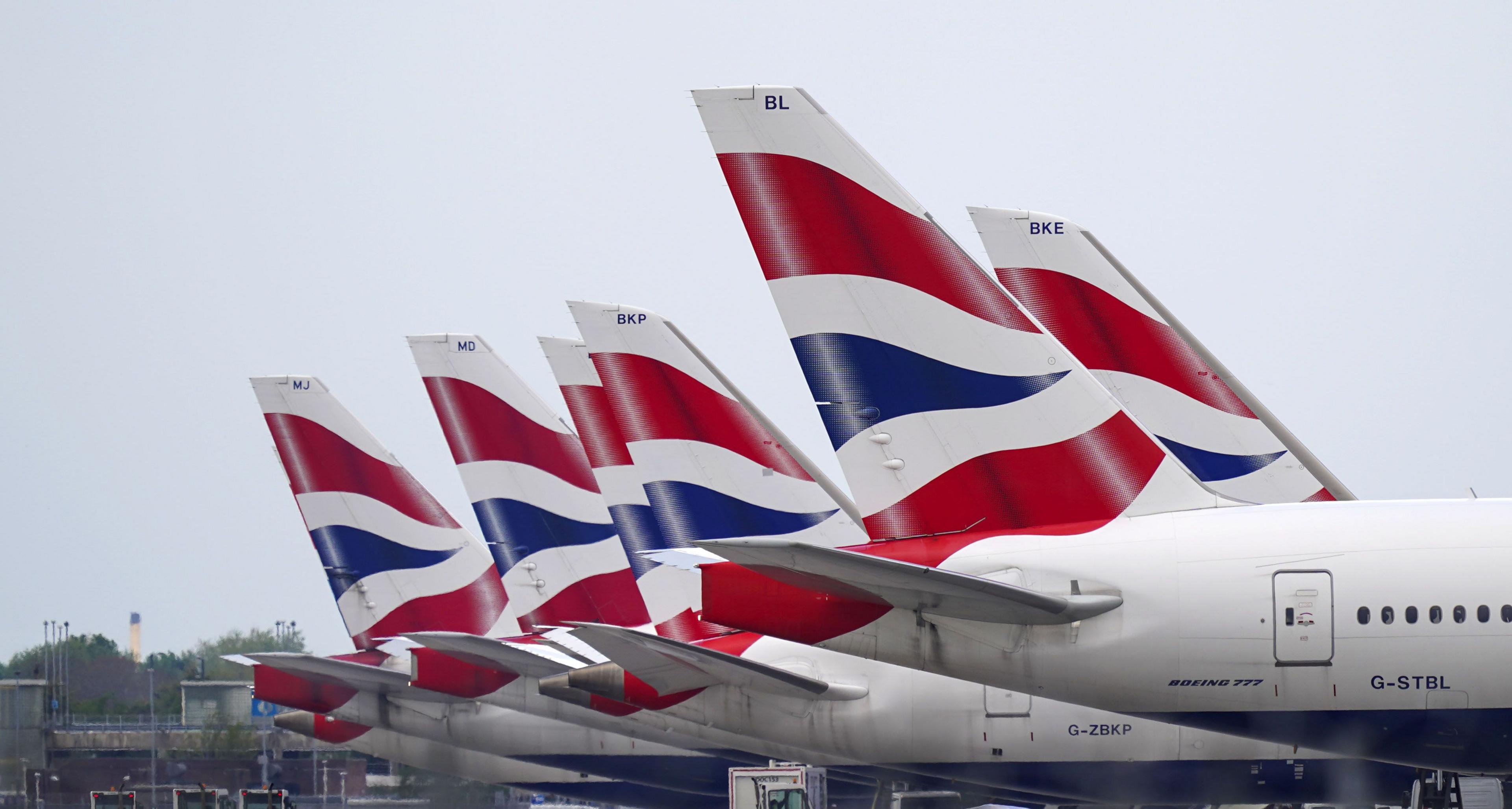 Tail fins of British Airways planes at Heathrow Airport, West London.