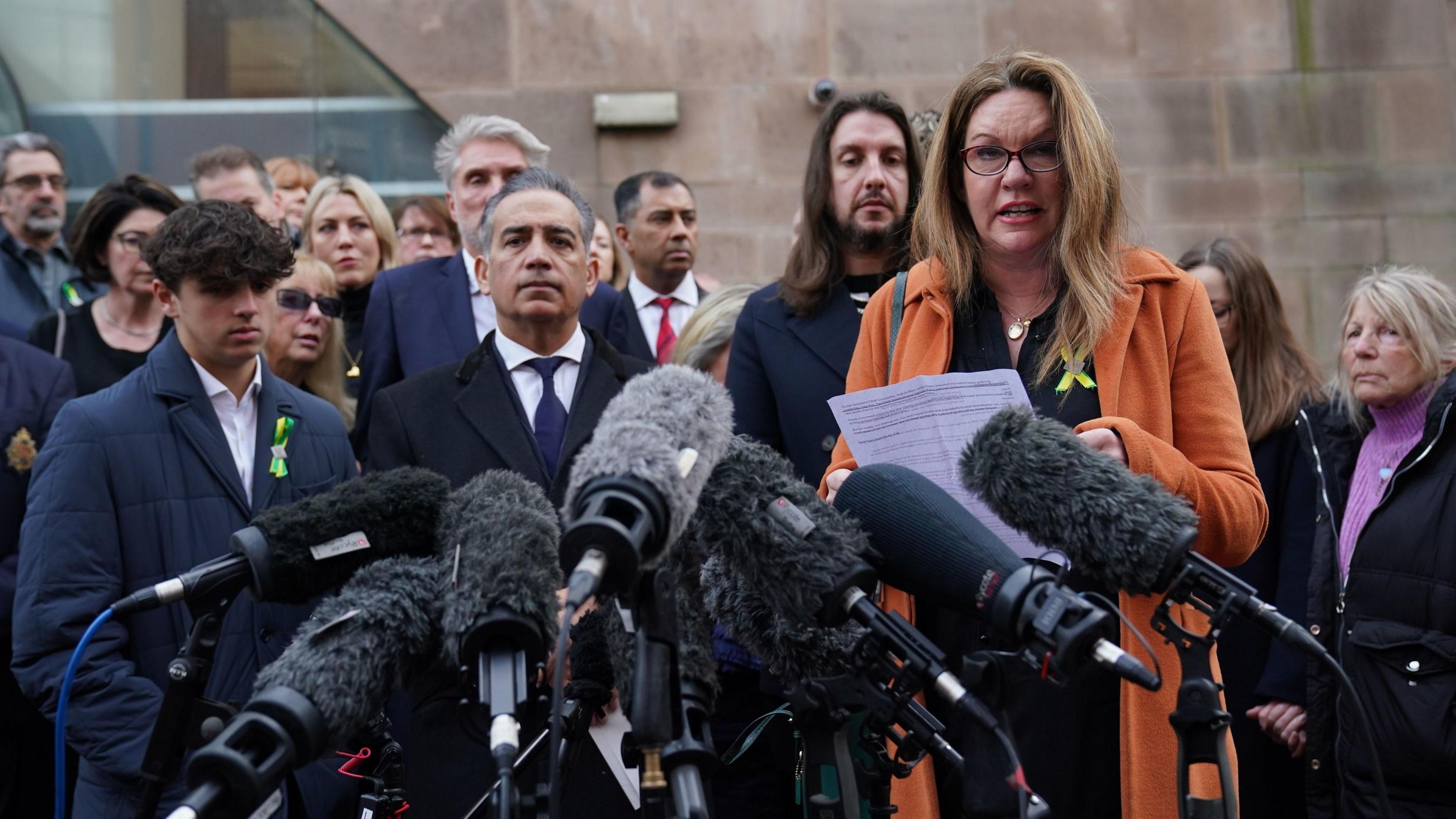 Emma Webber speaking outside in court alongside other family members of those killed in the Nottingham attacks