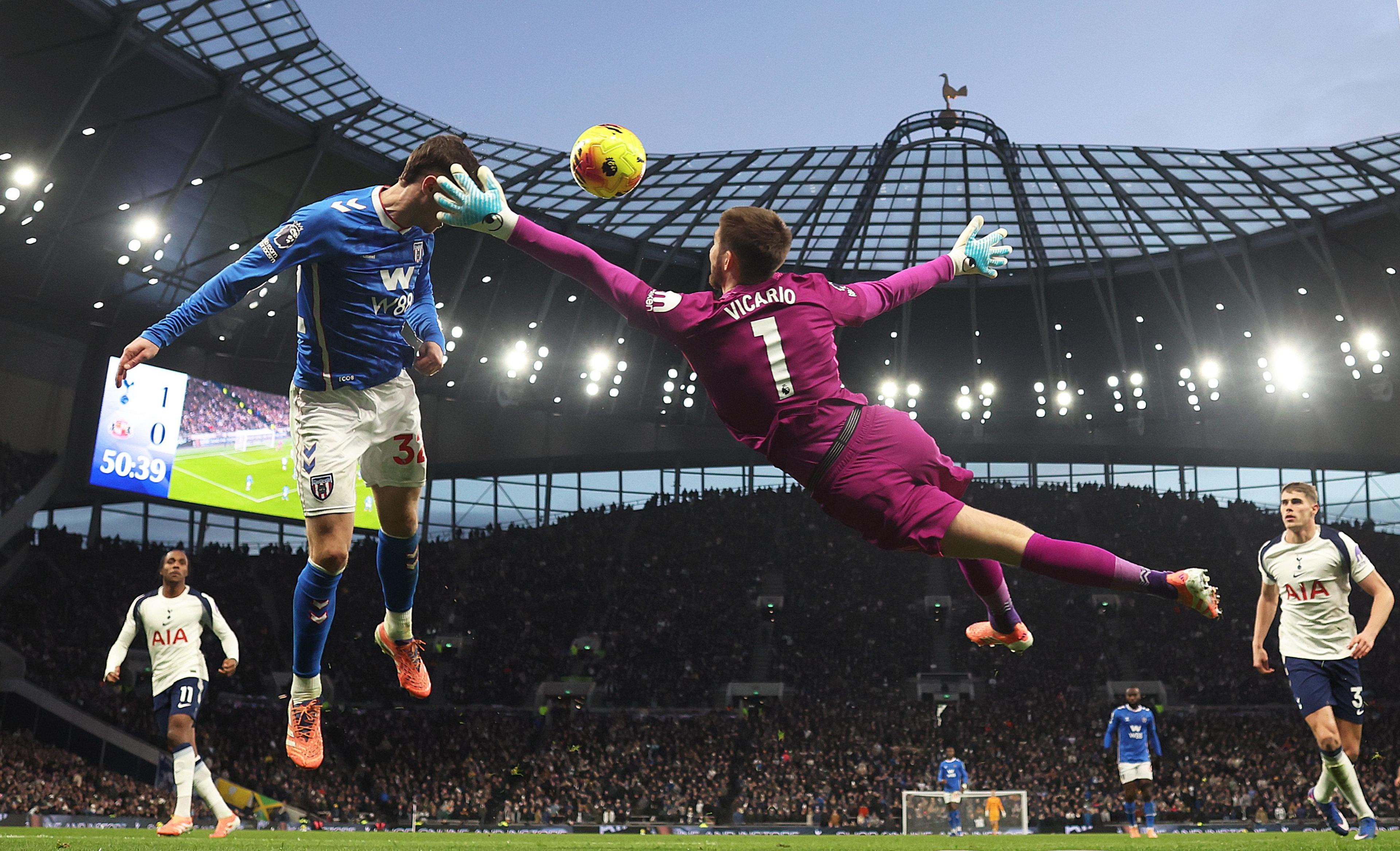 A header from Sunderland's Trai Hume as Tottenham's Guglielmo Vicario attempts to clear the danger. Photo by Julian Finney