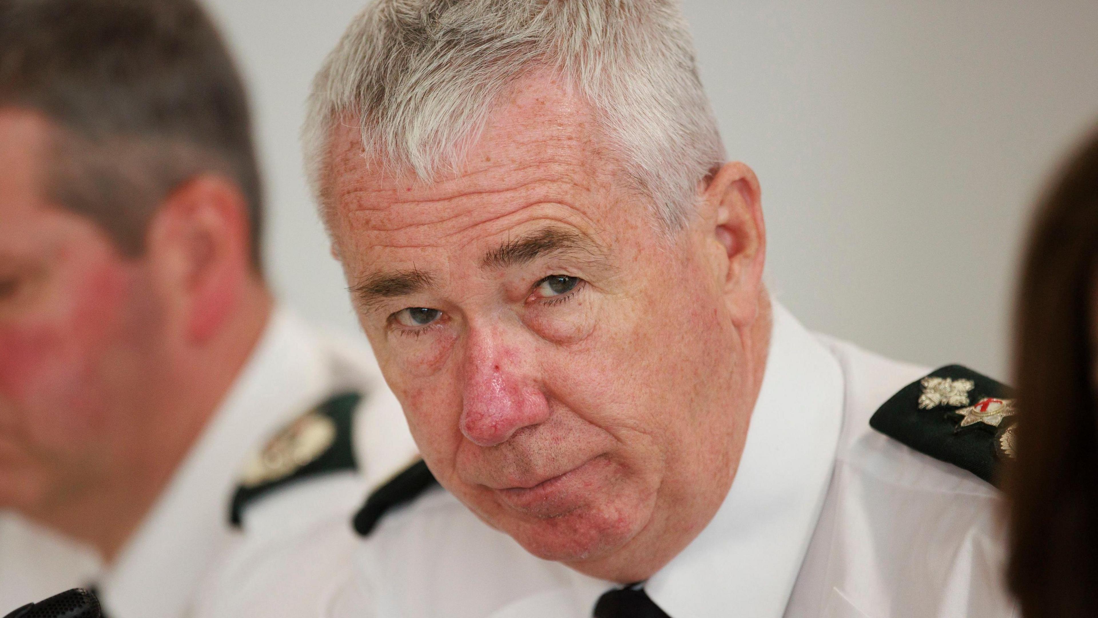 Jon Boutcher - a man with short grey hair and a police uniform