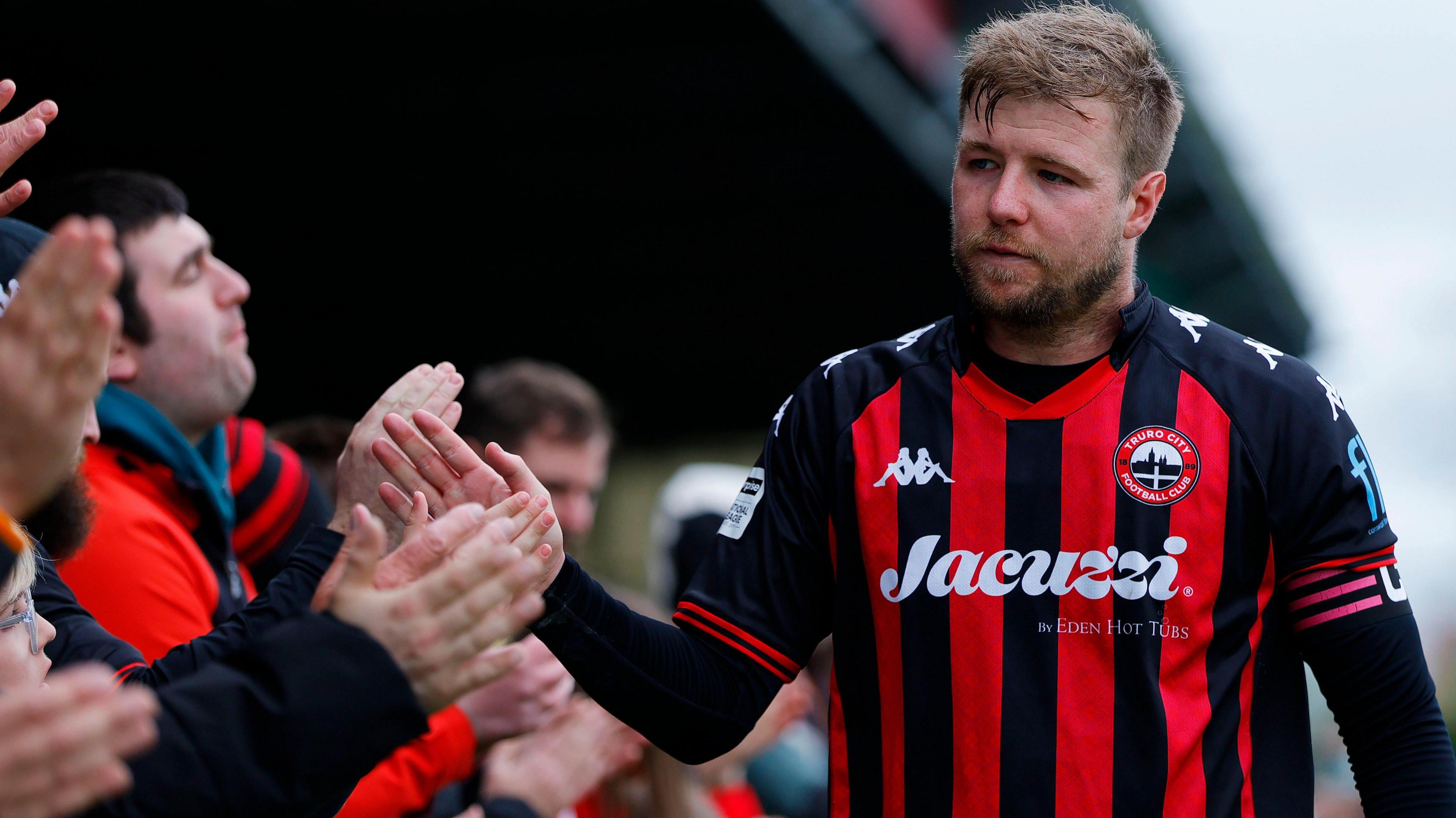 Connor Riley-Lowe shakes supporters' hands