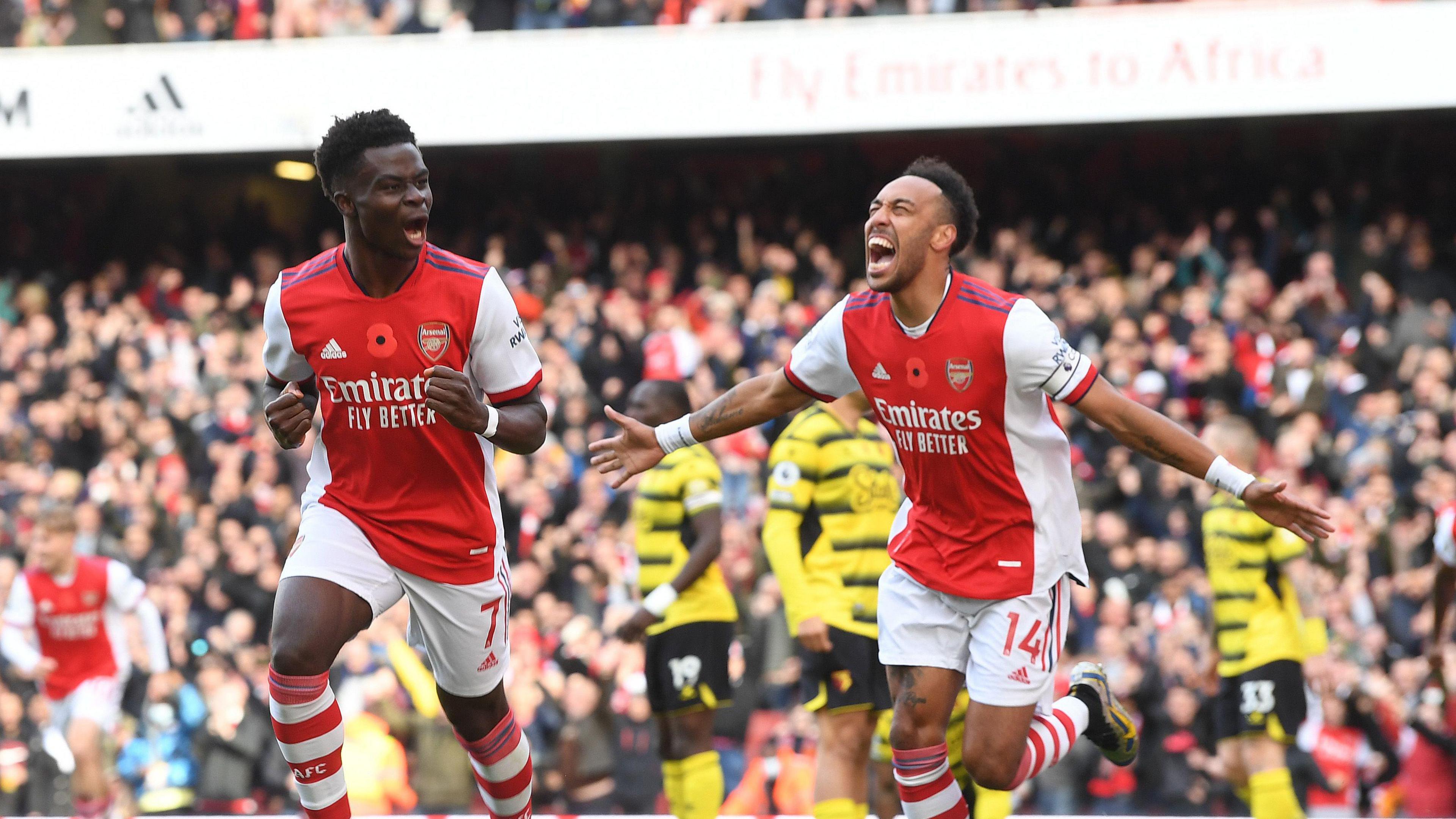 Bukayo Saka and Pierre Emerick-Aubameyang celebrate for Arsenal