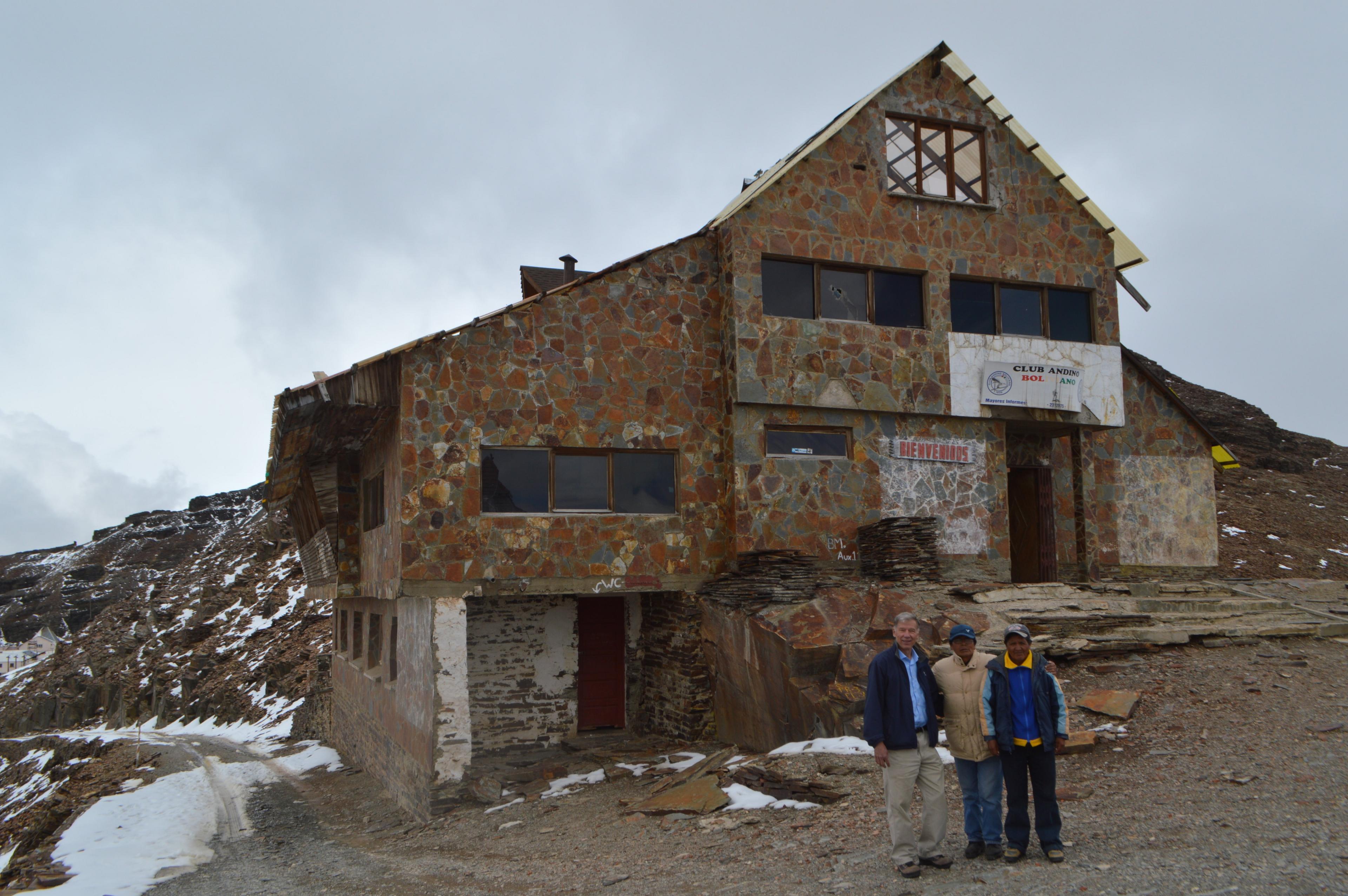 Felipe Kittelson, Samuel and Adolfo Mendoza stand in front of the abandoned ski resort of Chacaltaya