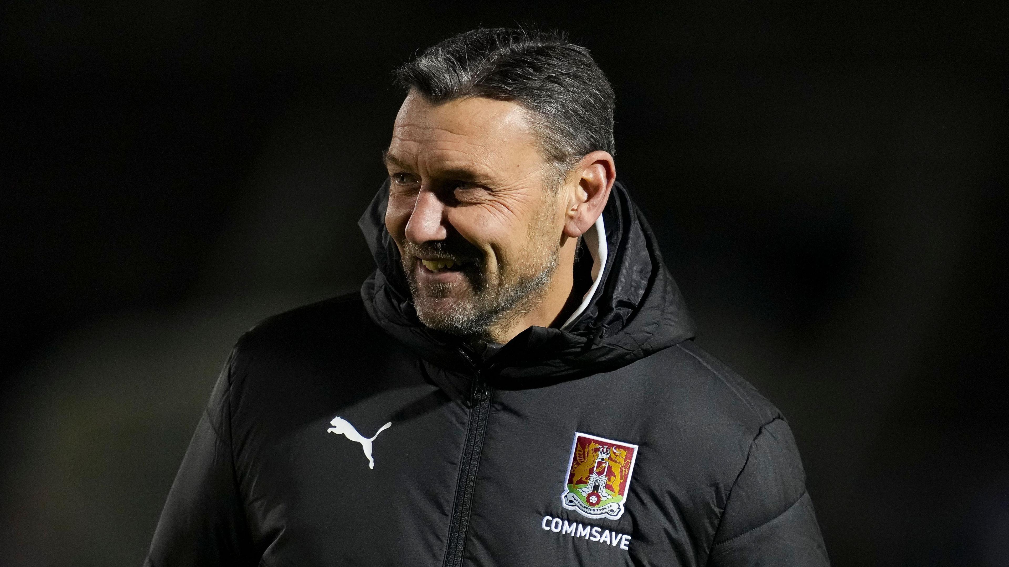 Caretaker boss Ian Sampson celebrates Cobblers victory over Peterborough 