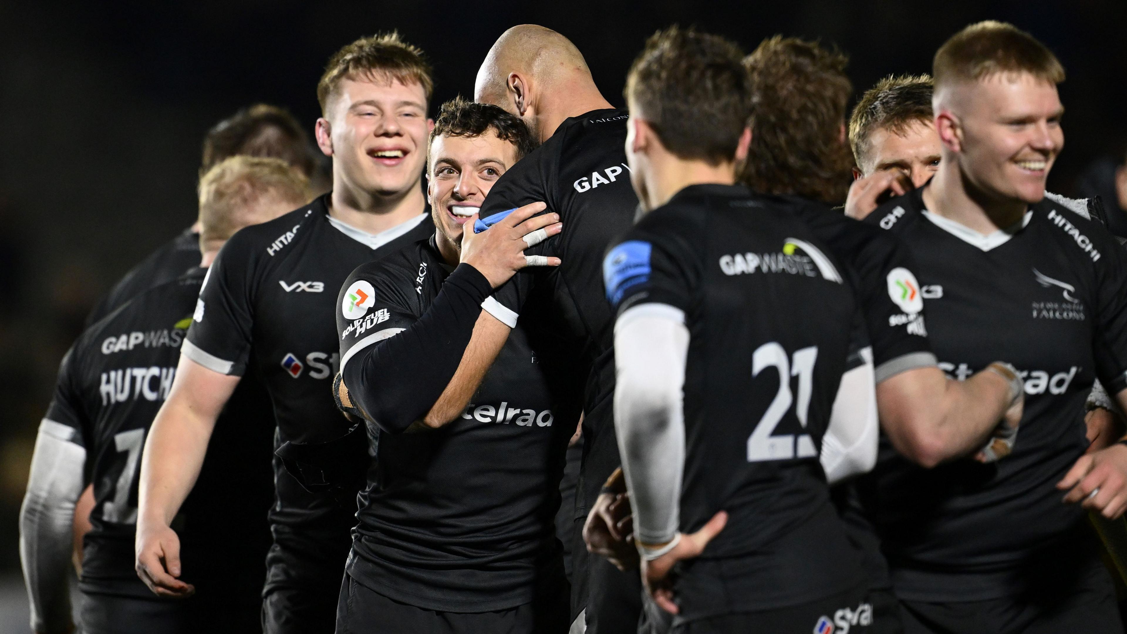 Newcastle players celebrate beating Saracens at Kingston Park