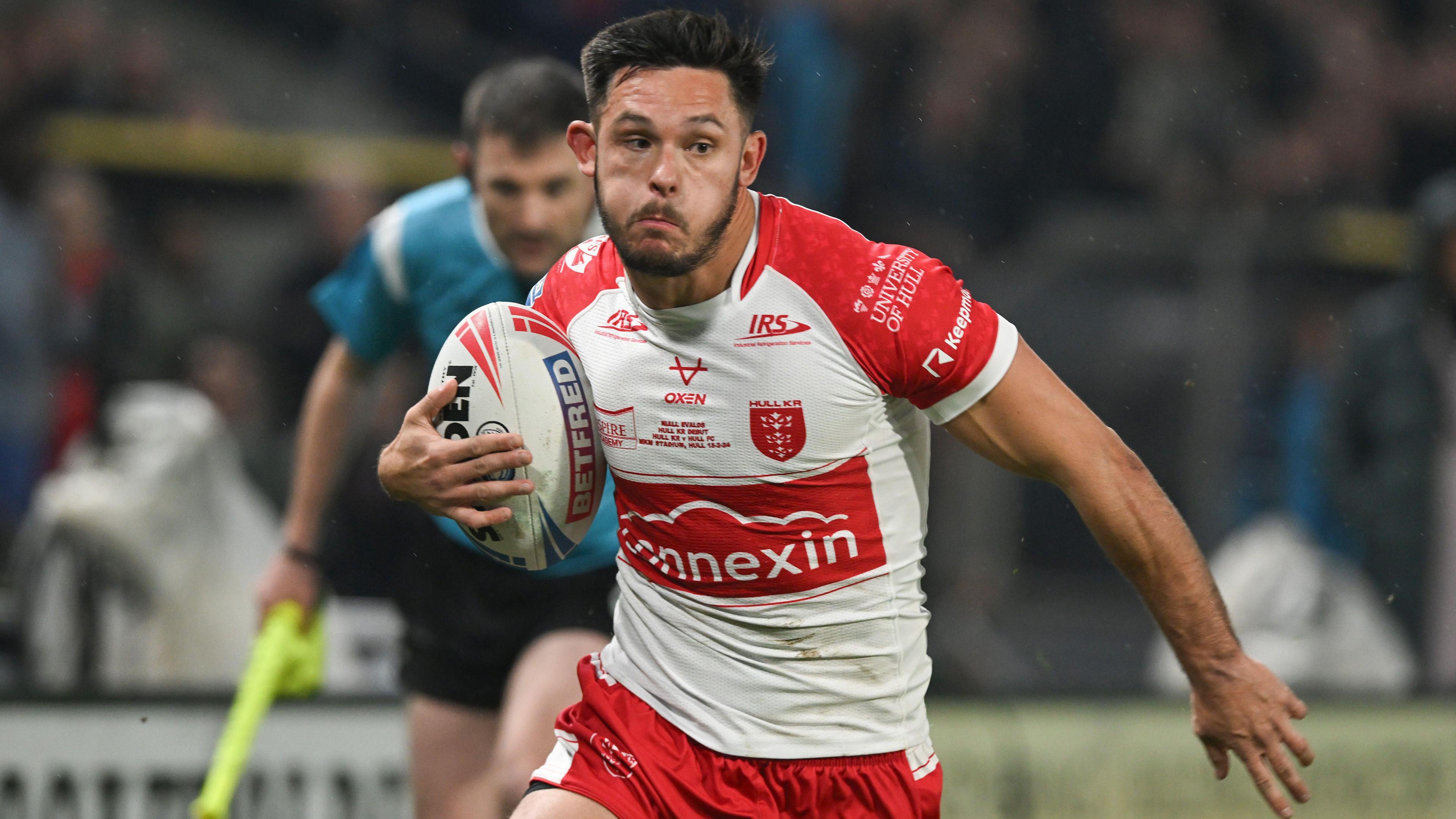 Niall Evalds on a bursting run forward with the ball during a game for Hull KR