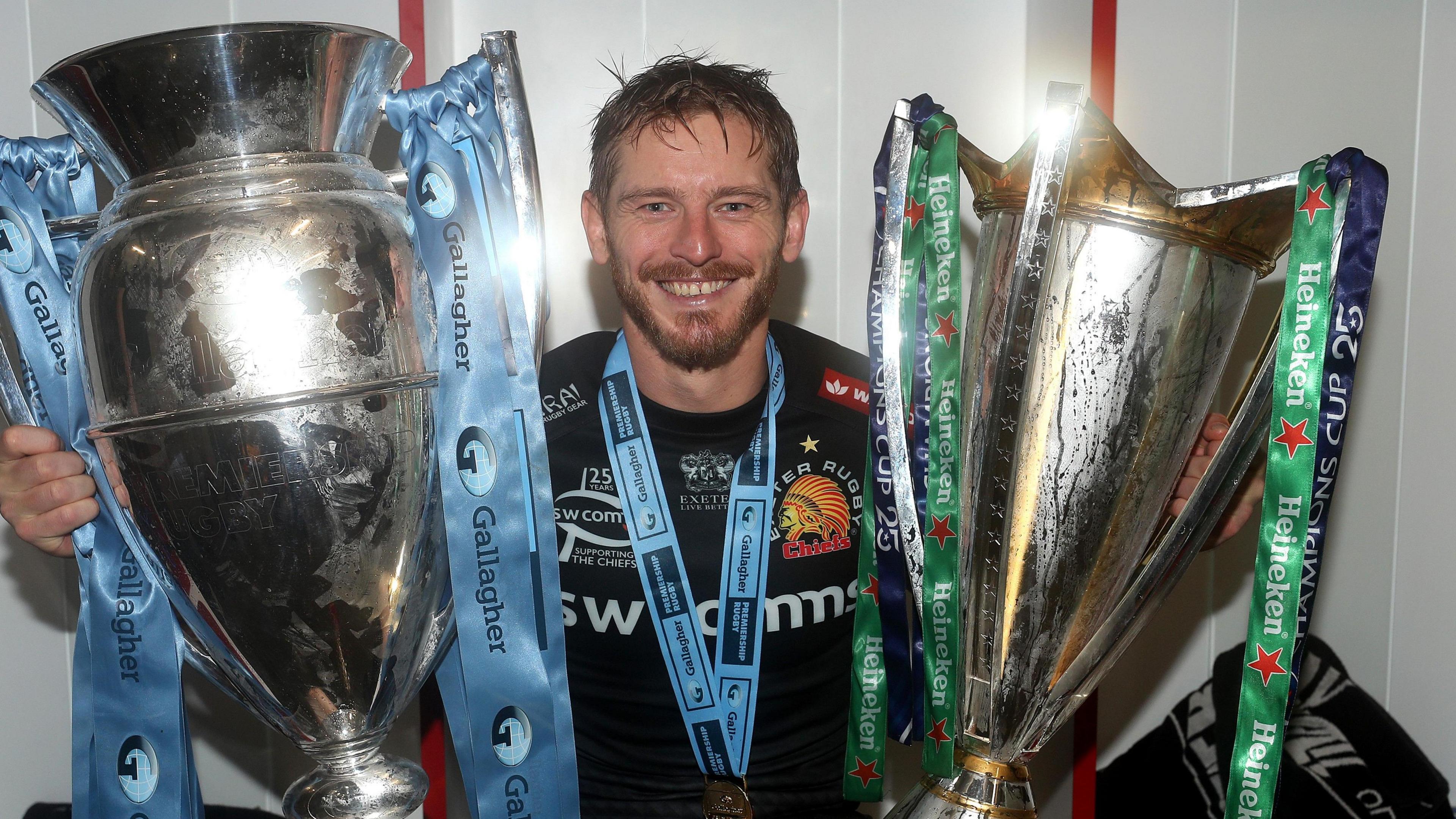 Gareth Steenson poses with the Premiership and Heineken Cup trophies