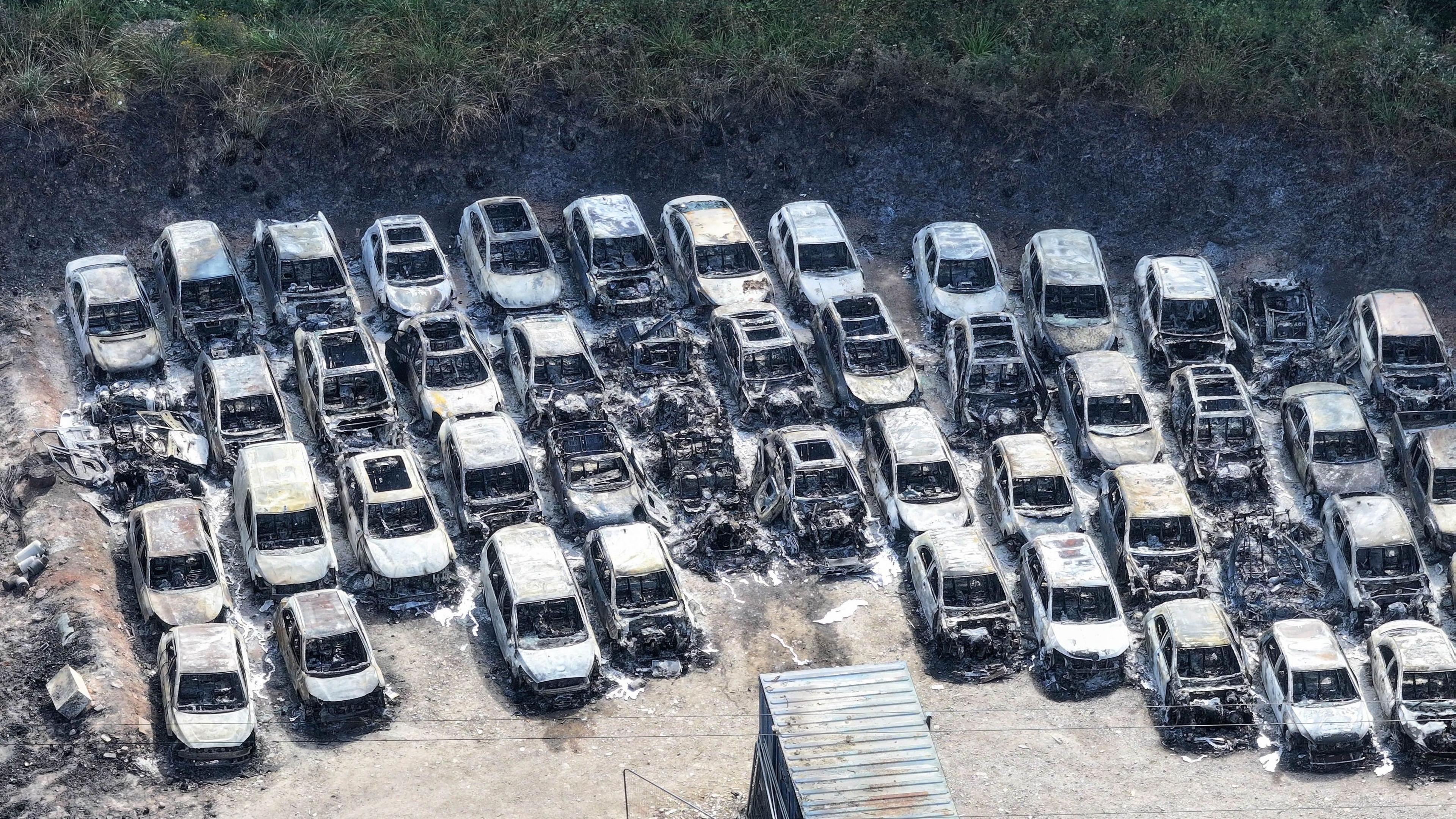 A row of burnt out cars.