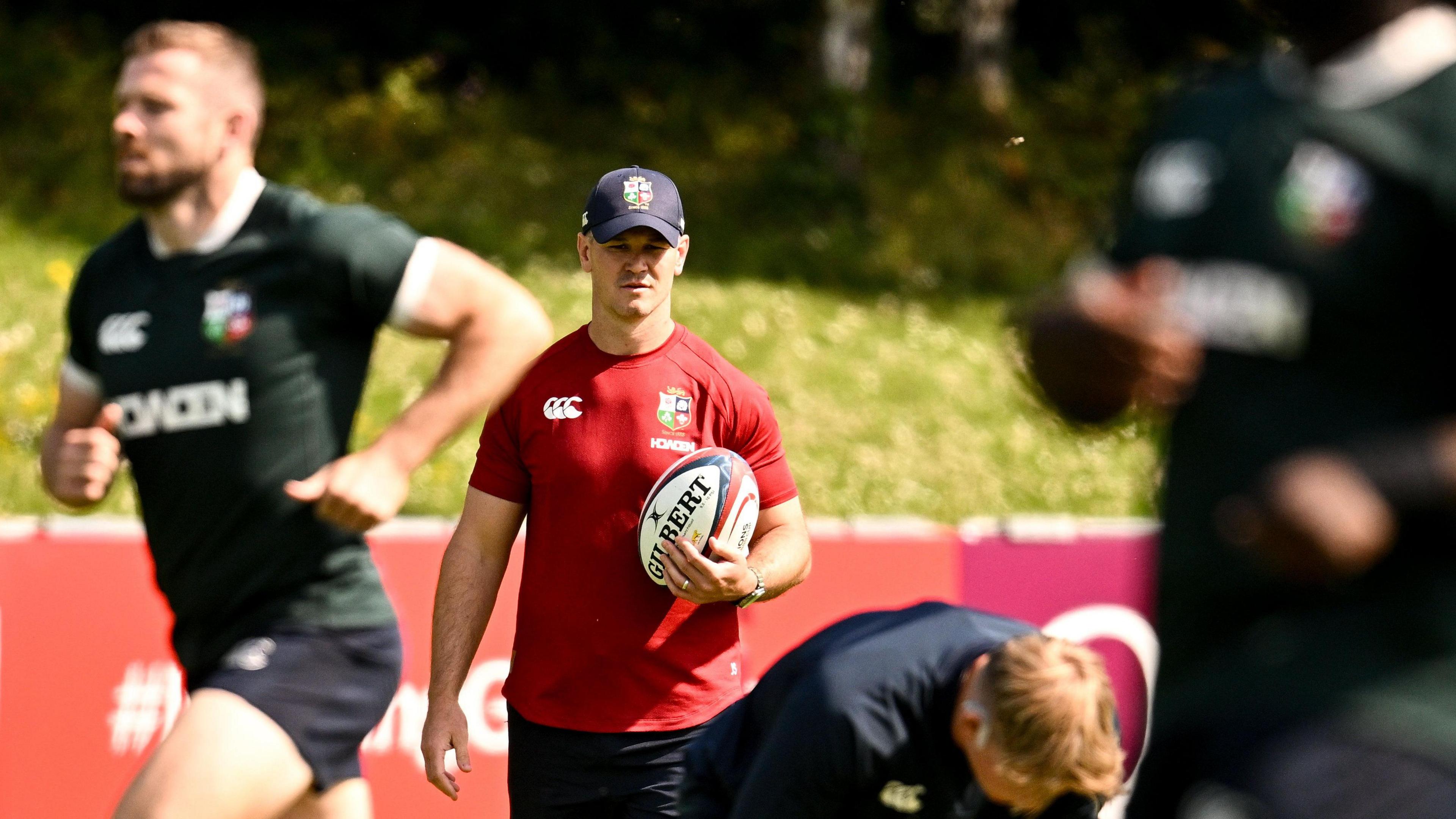 Johnny Sexton watches on as the Lions train at University College Dublin on Monday