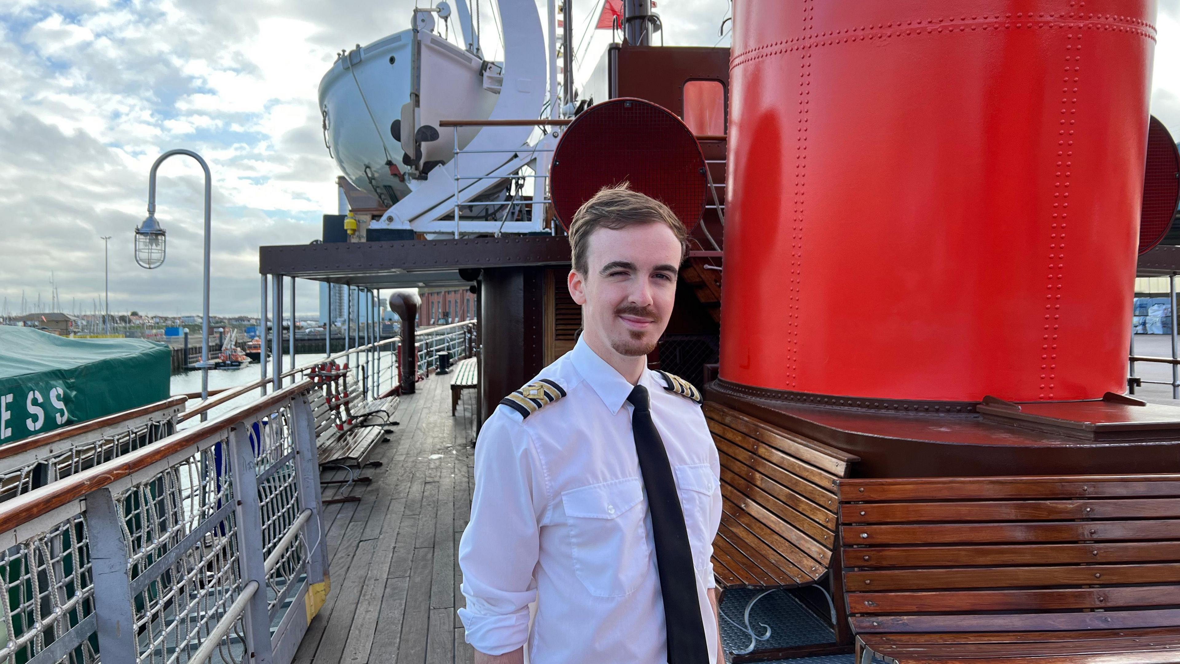 Andrew Comrie on the deck of the ship